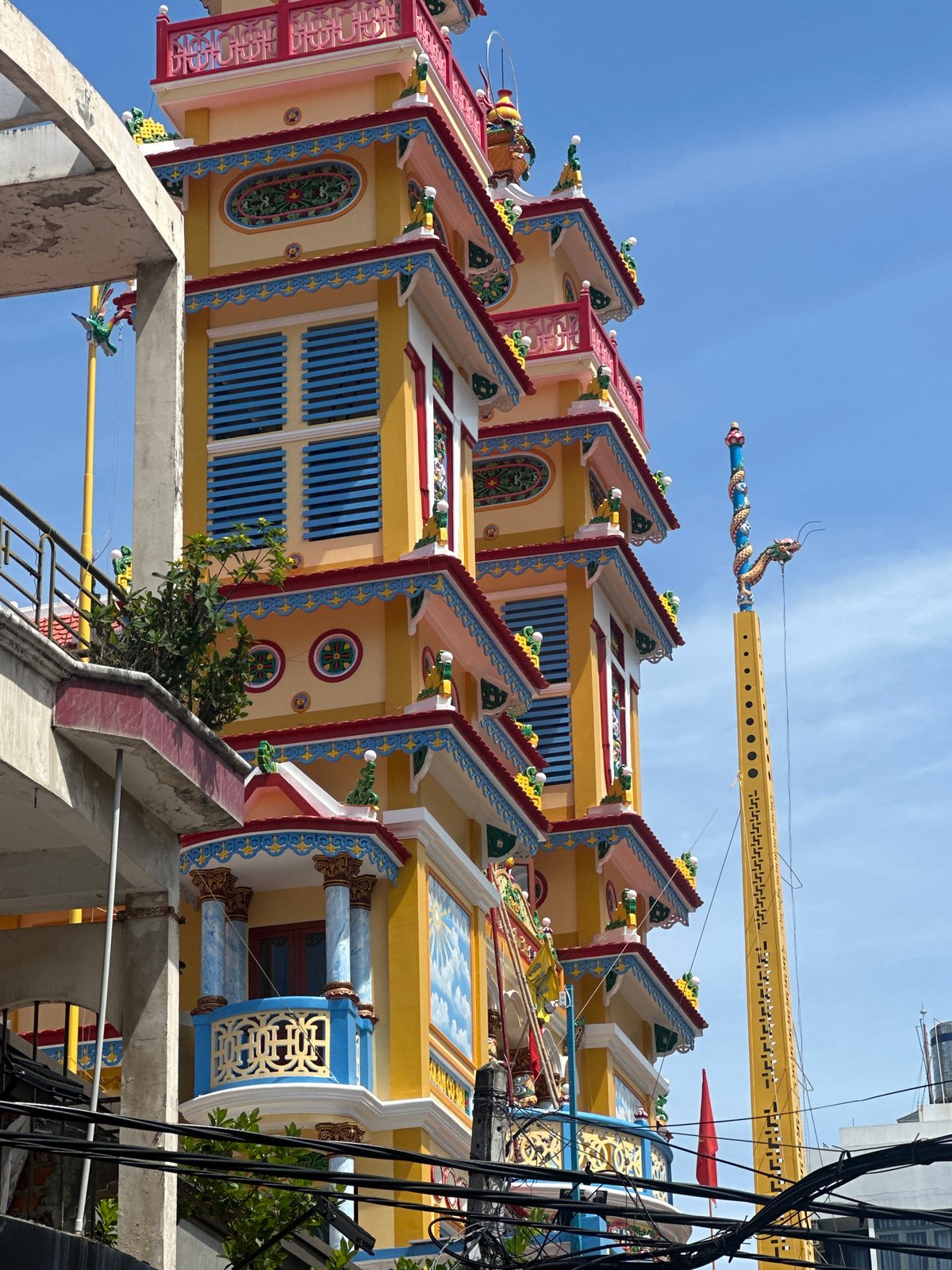 Tourist captures colorful pagoda and beach vendors in Nha Trang