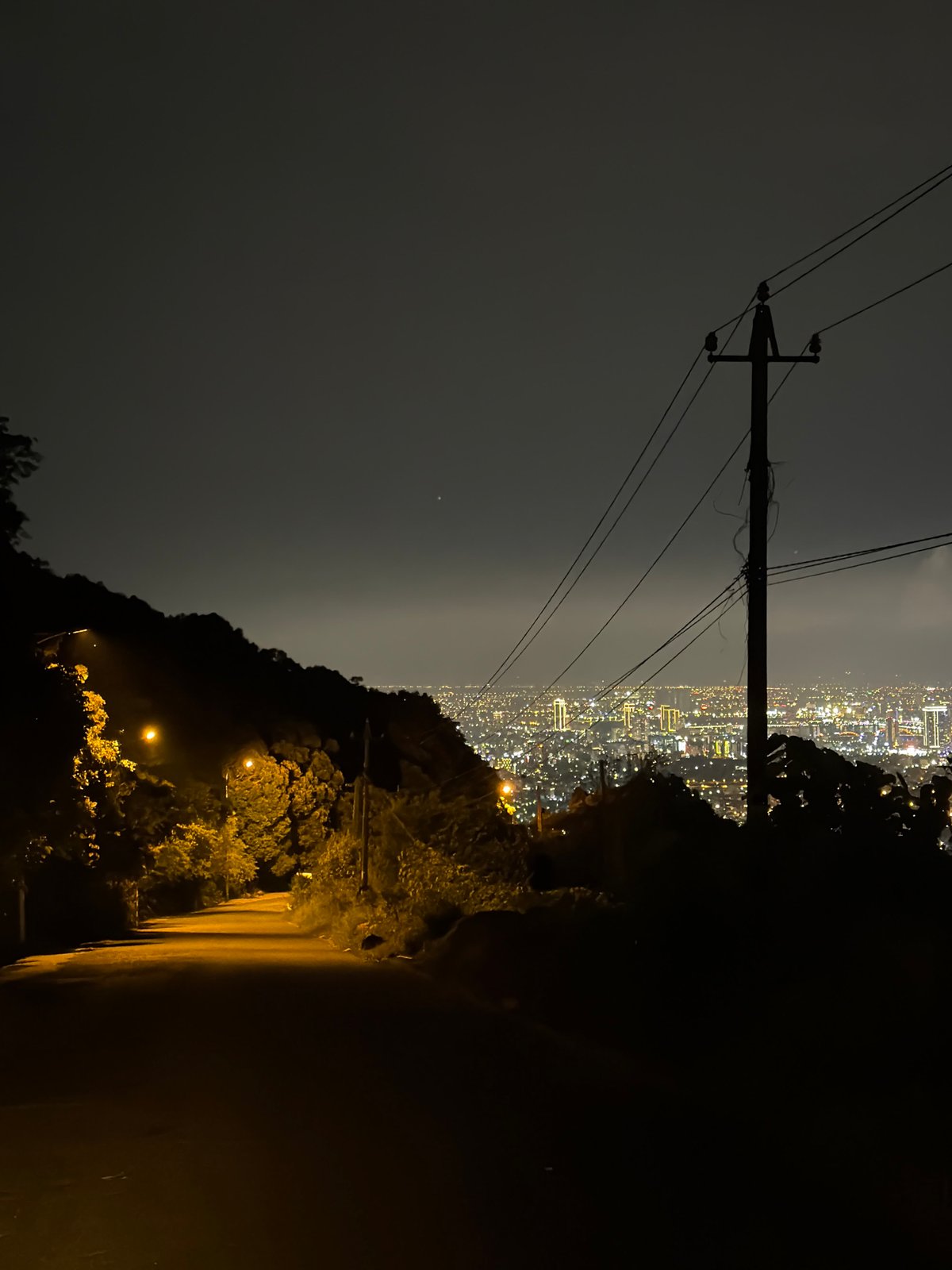 Elevated nighttime view captures illuminated Đà Nẵng cityscape