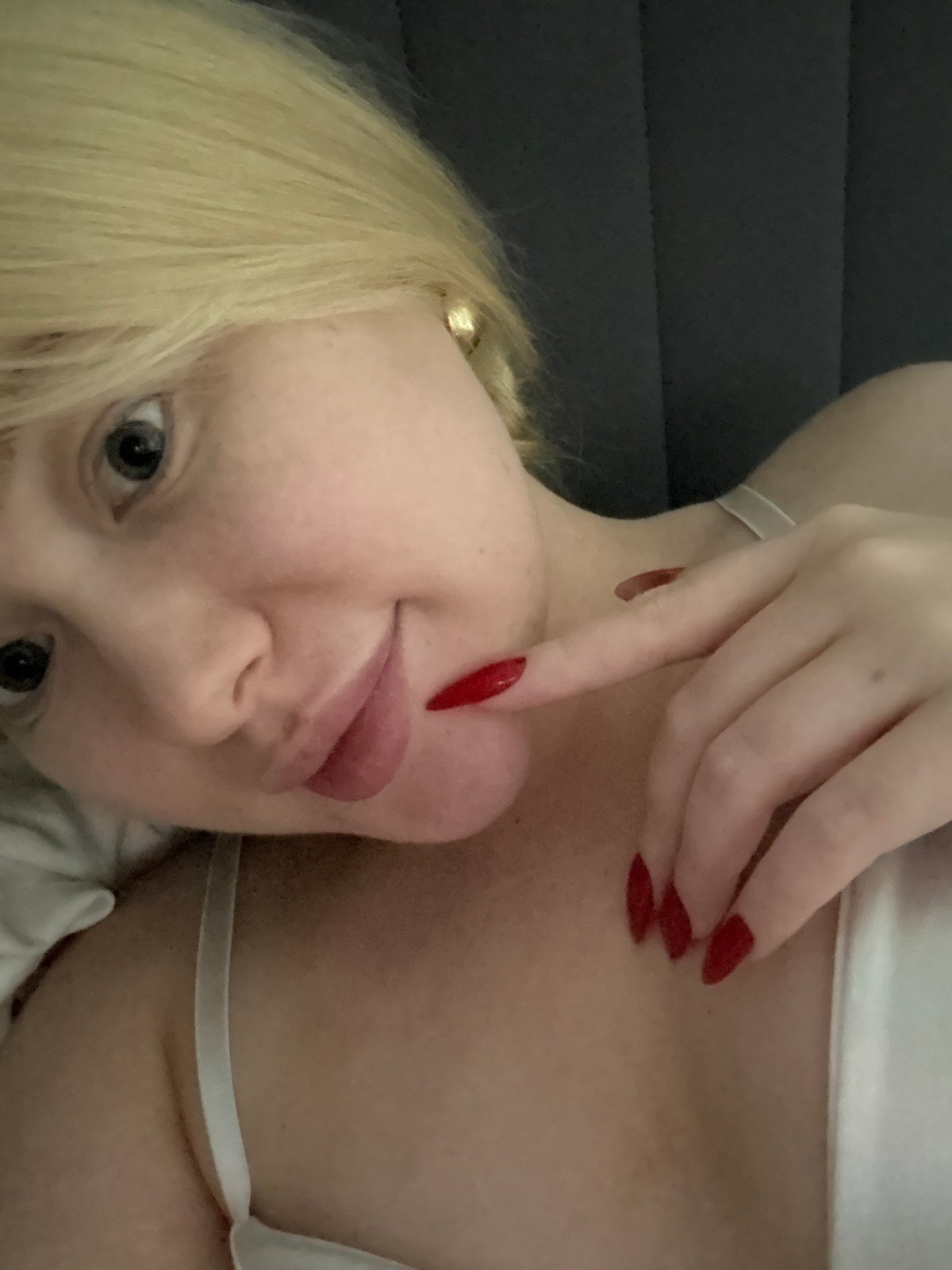 Lazy evening at home with a cat, nails, and a self-help book