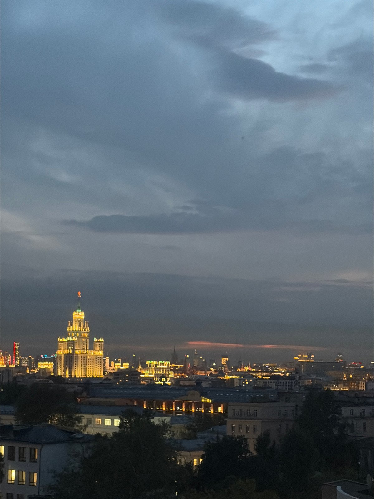 Moscow skyline transitions from dusk to night, July 2026
