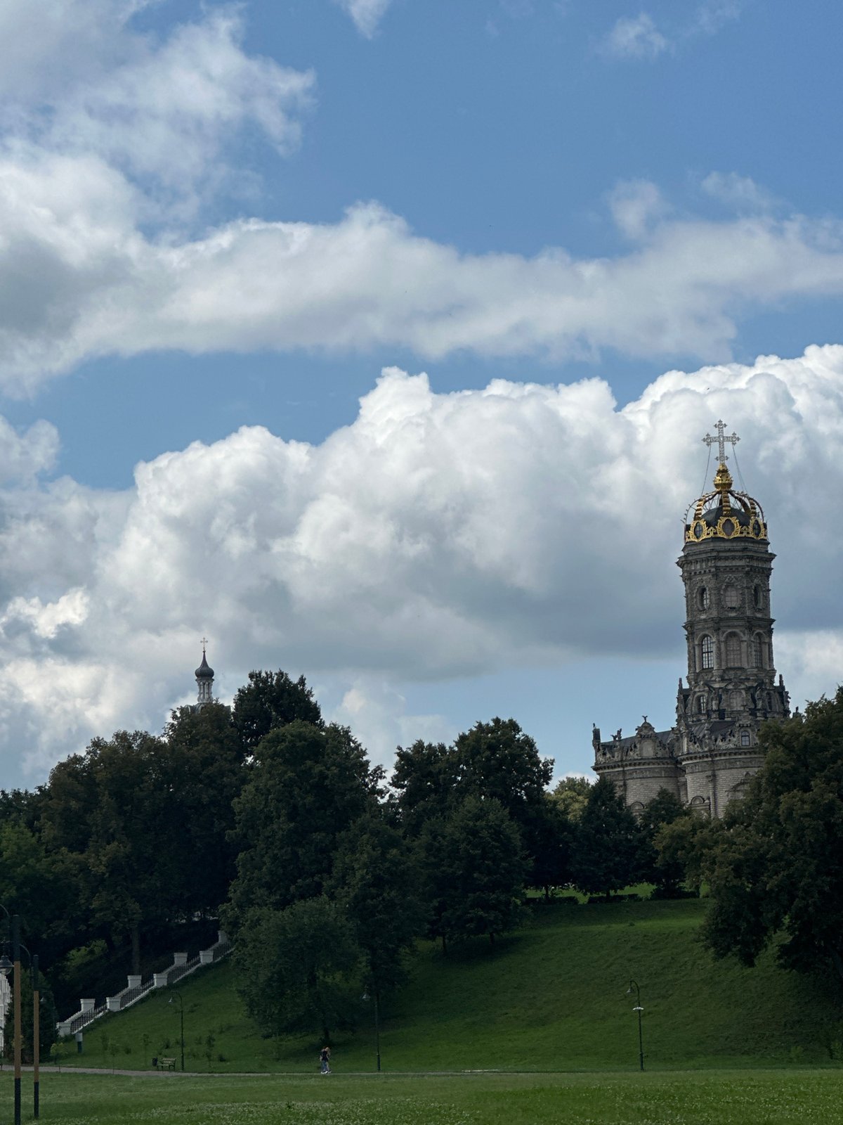 Summer day at Dubrovitsy: historic church, river, paddleboards