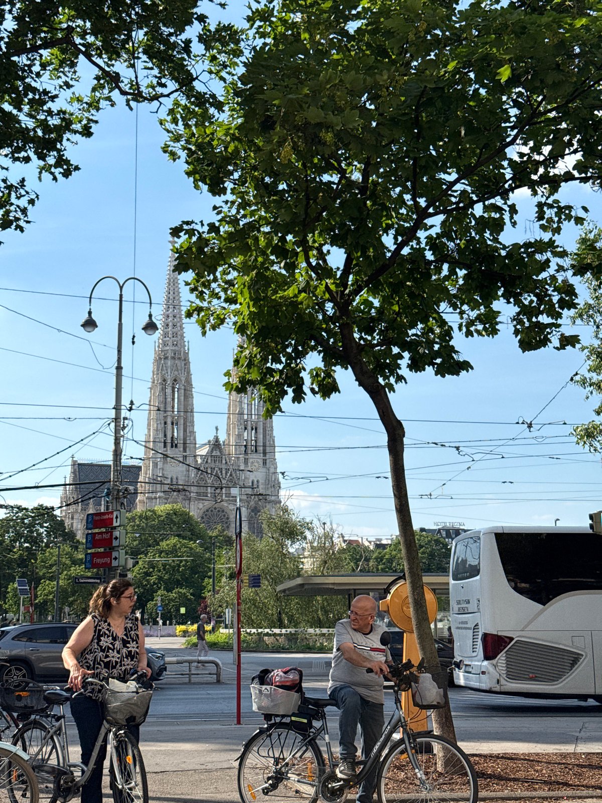 Tourist documents Vienna landmarks during afternoon walking tour