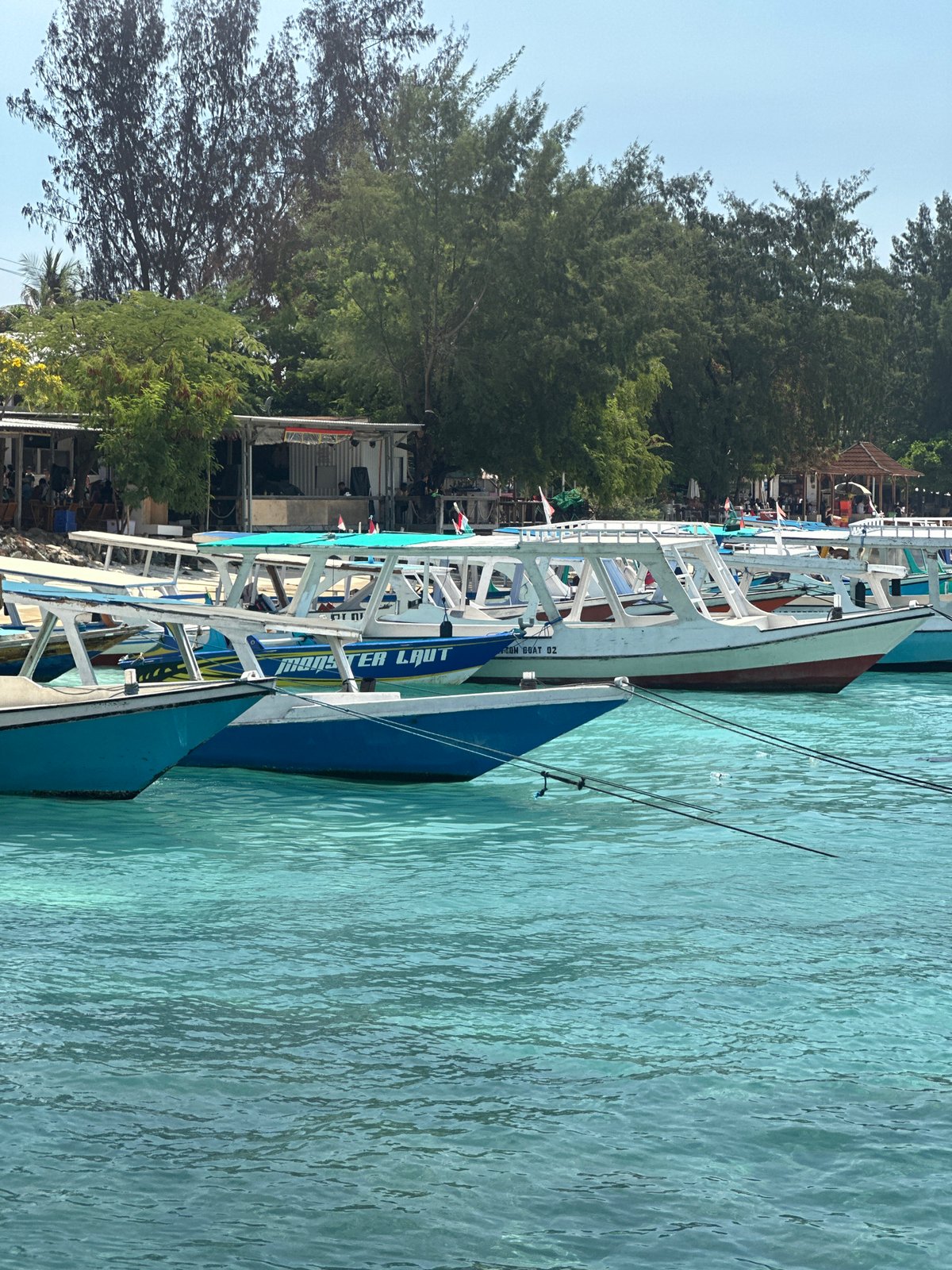 Morning boat departure scenes captured at Indonesian coastal pier