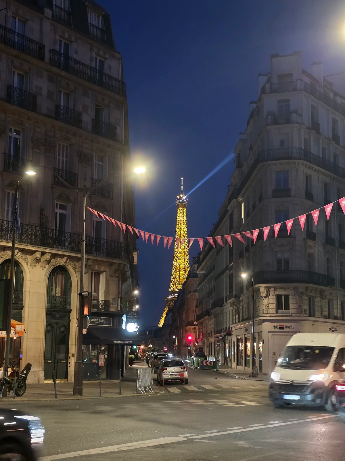 Summer night out in Paris, Eiffel Tower glowing in the background
