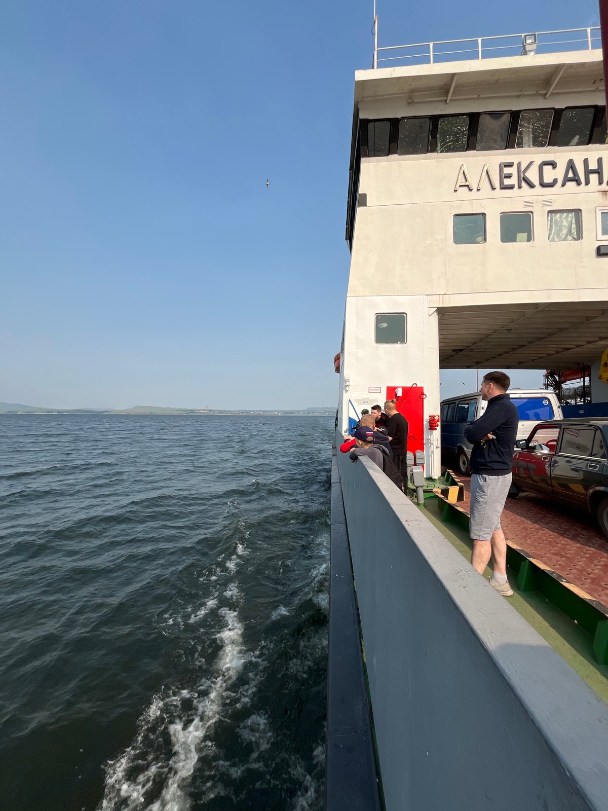 Ferry crossing the Krasnoyarsk Reservoir past forested Siberian hills