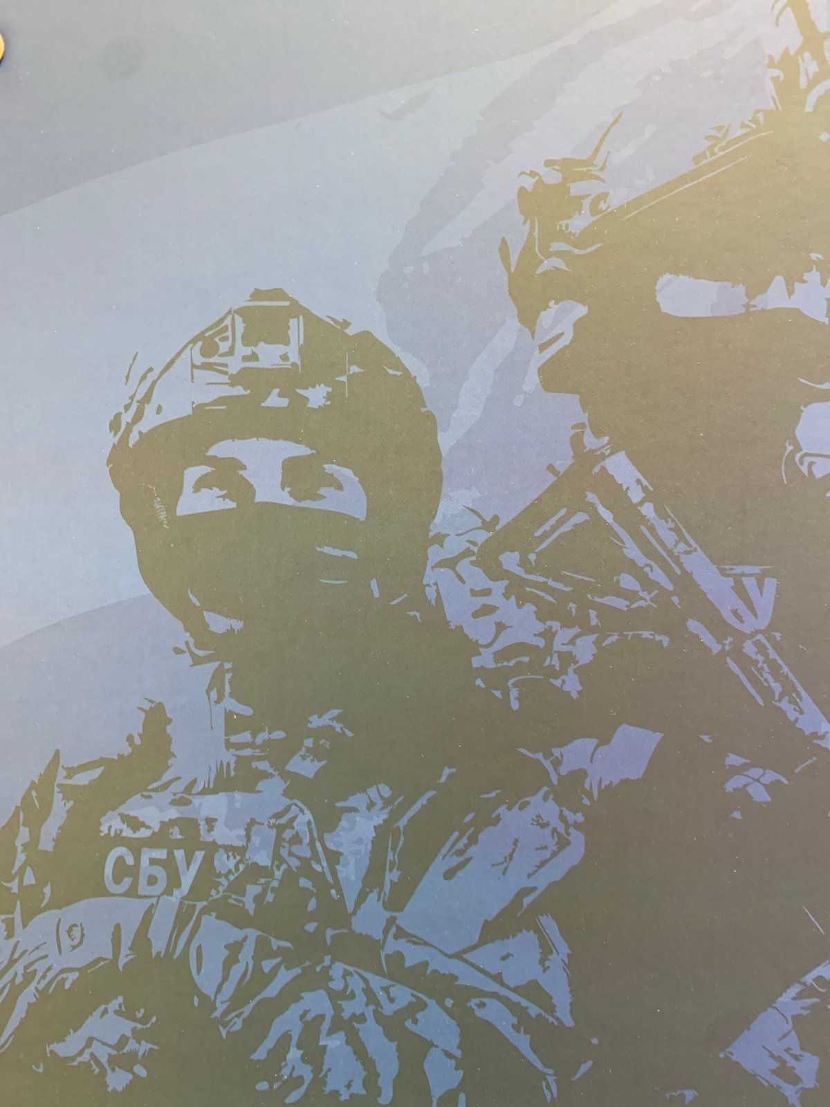 Office space snapshot with decorative objects and military print materials