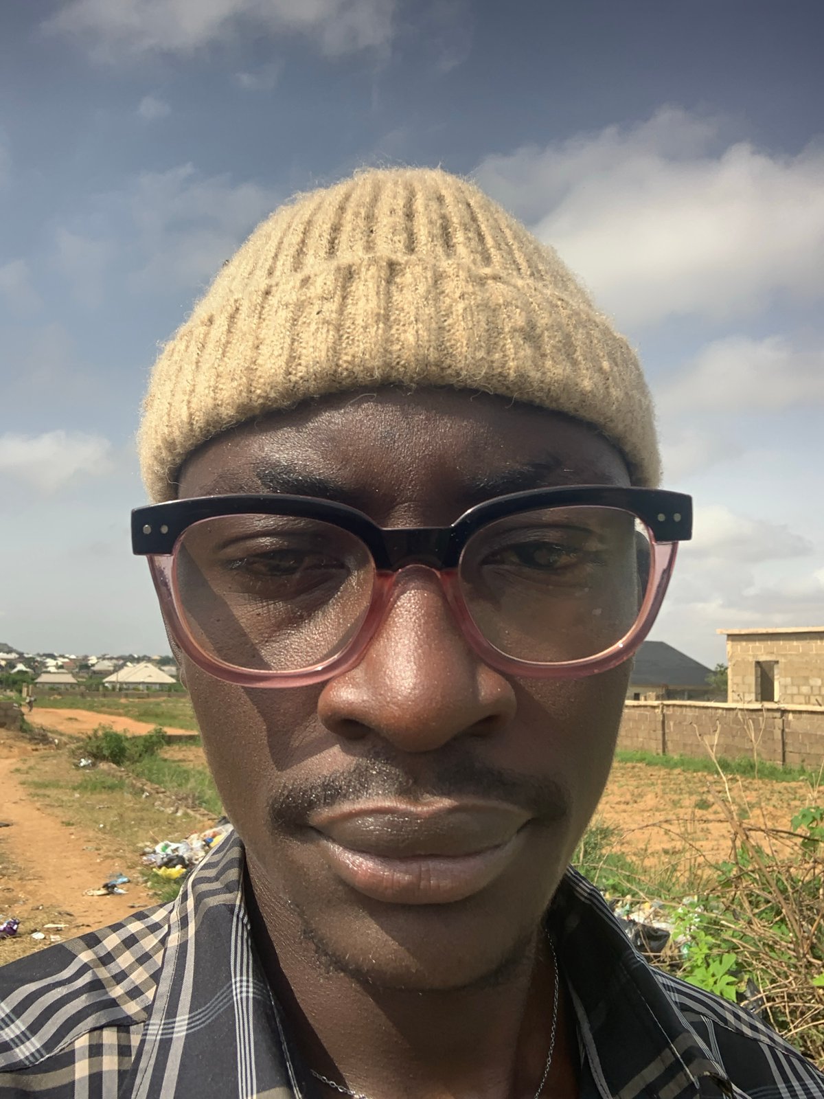 Selfies and street scenes from a rocky, semi-rural Jos morning