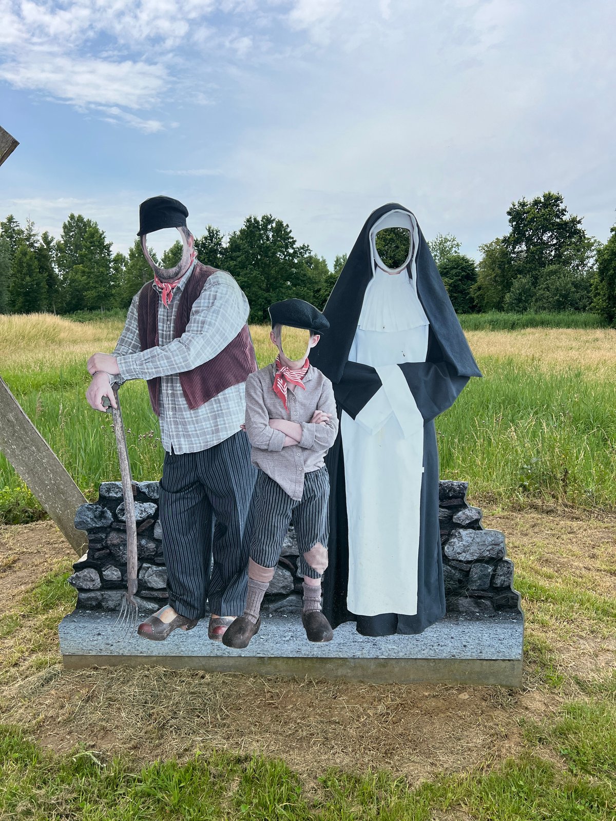 Historical mannequins and open meadow in Zichem, Belgium