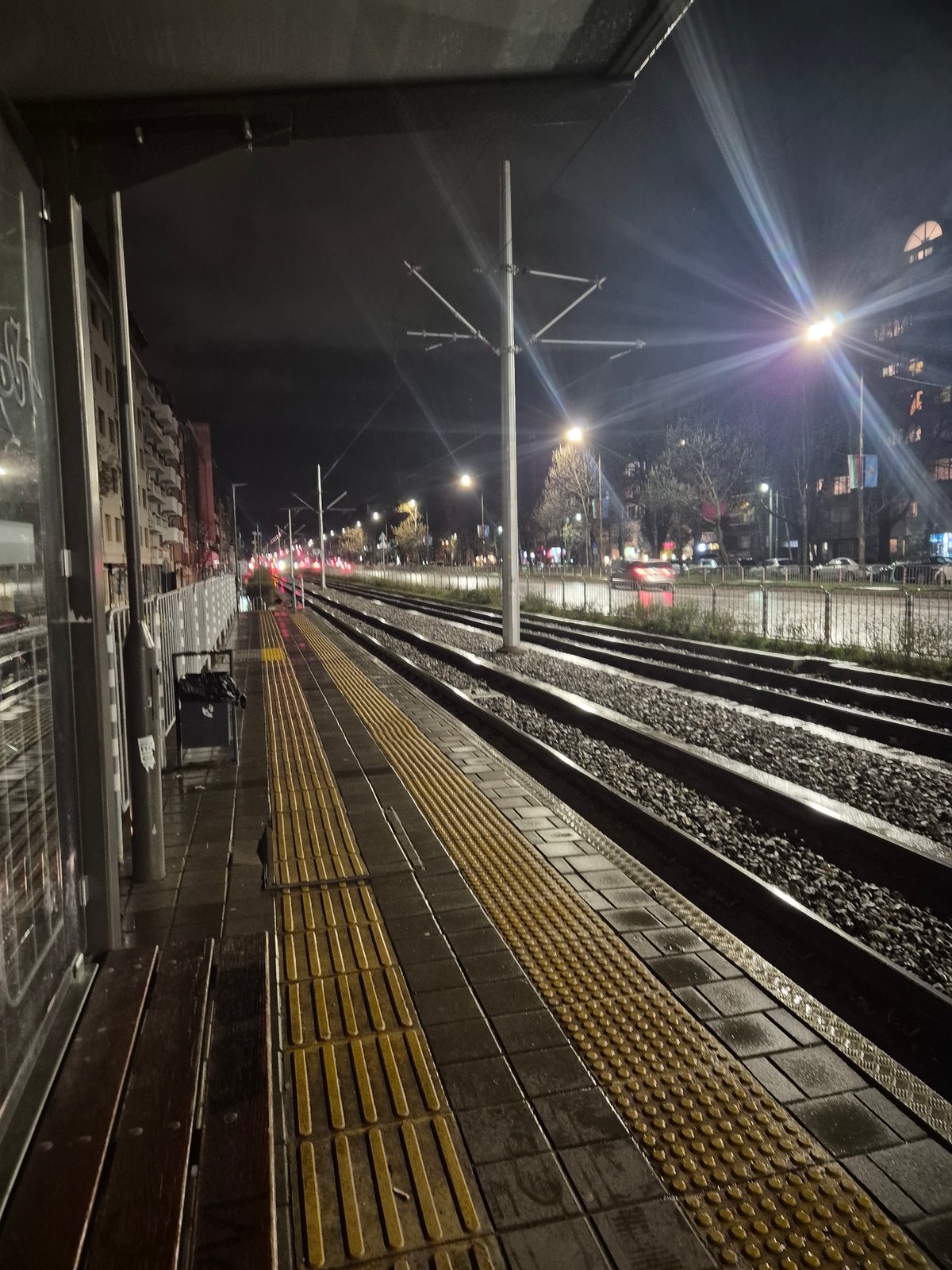 Nighttime train platform scene captured in Sofia, Bulgaria