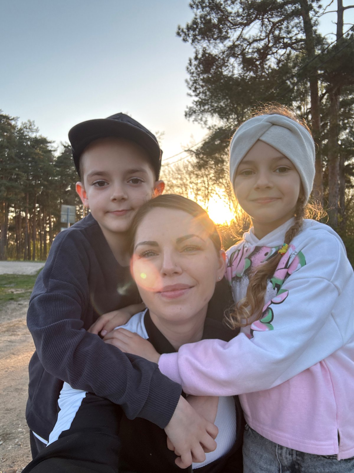 Family enjoys afternoon playground visit in Раздолье, Russia