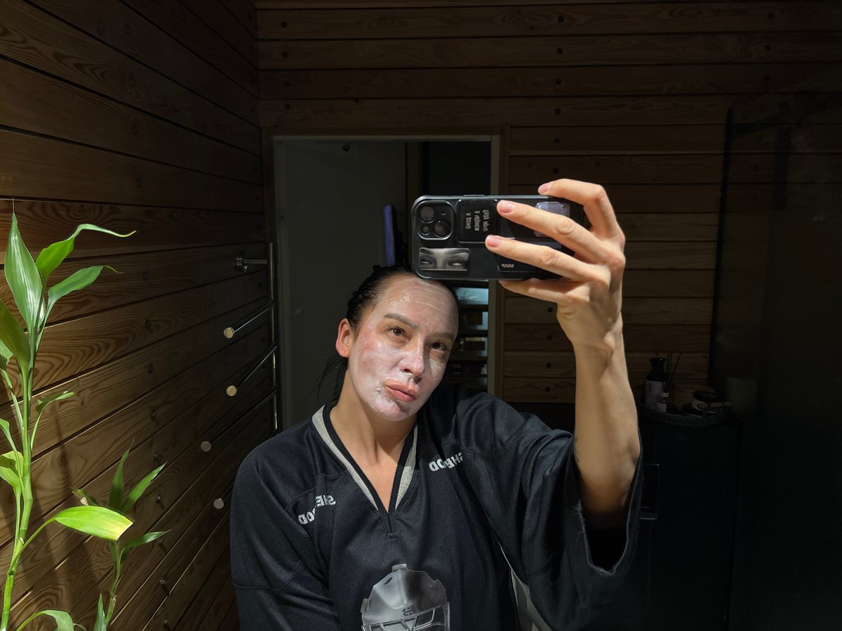 Woman documents skincare routine with pet dog in Russia