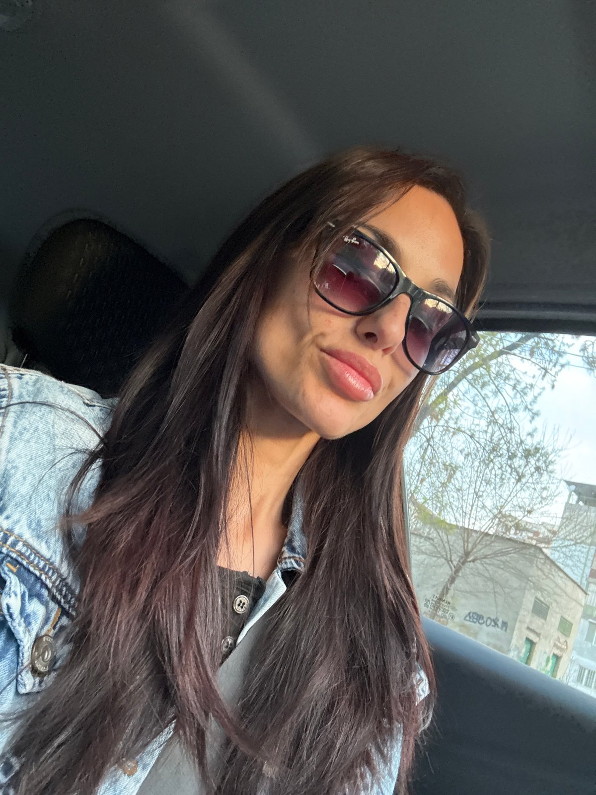 Woman takes early morning car selfie in Pleven
