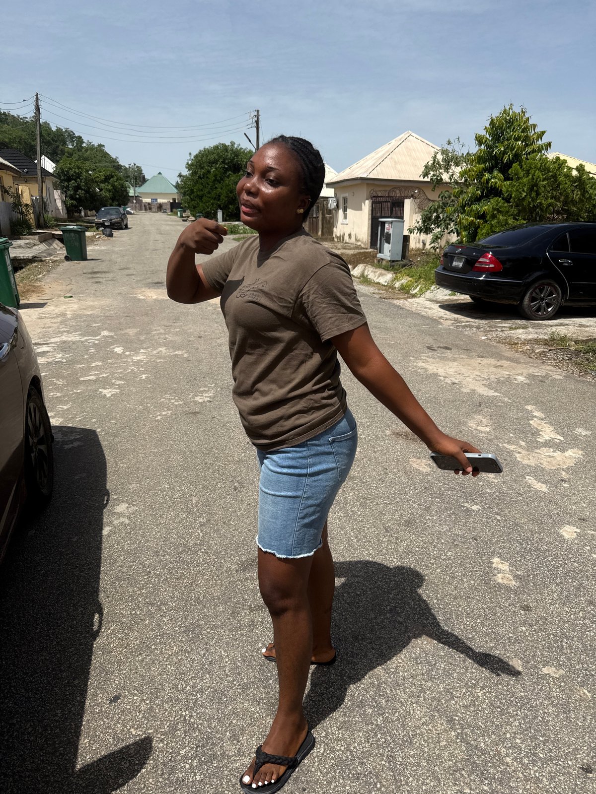 Residents document casual street activities in Abuja neighborhood