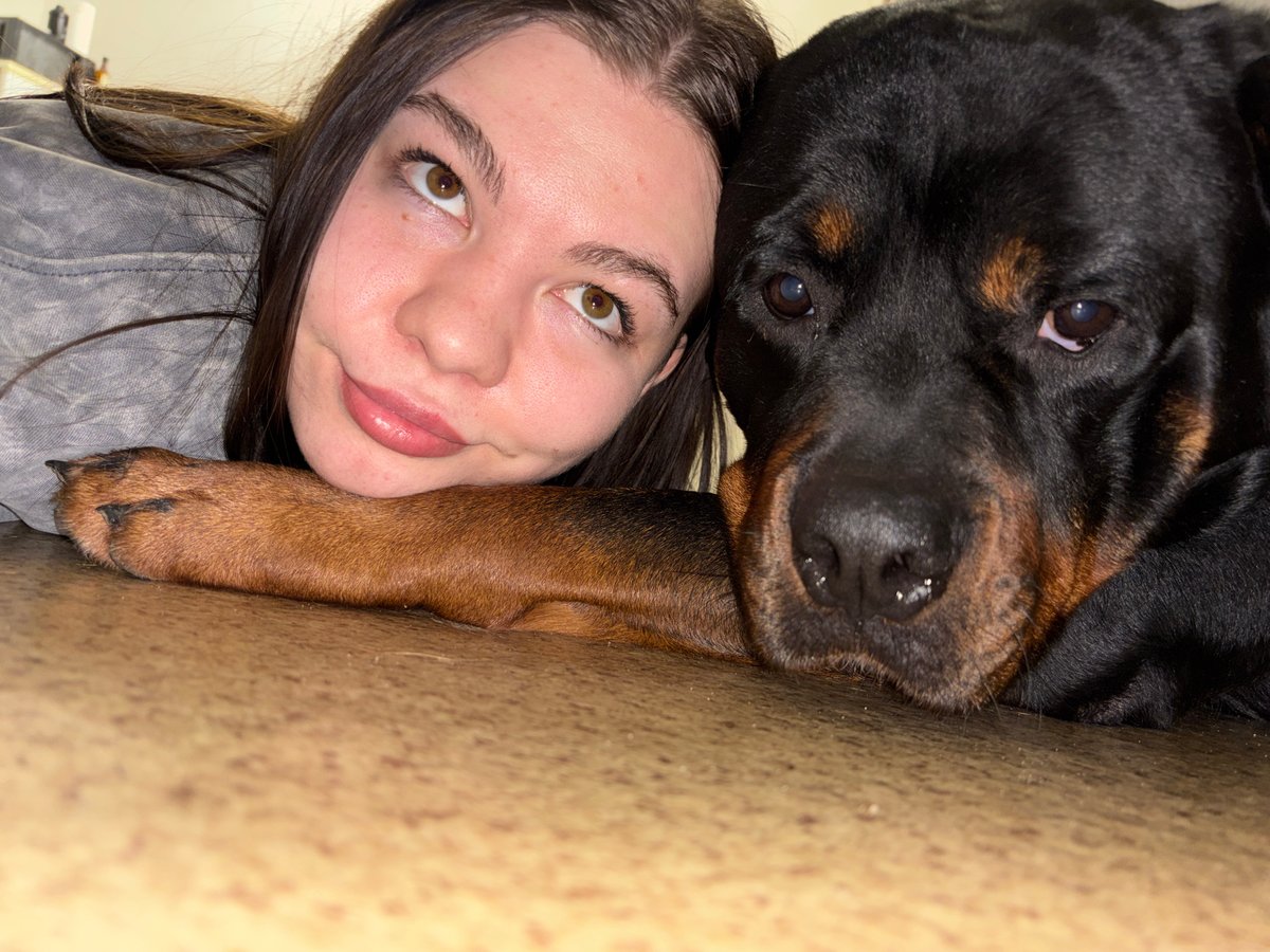 Woman's afternoon moments captured with dog and elevator selfie