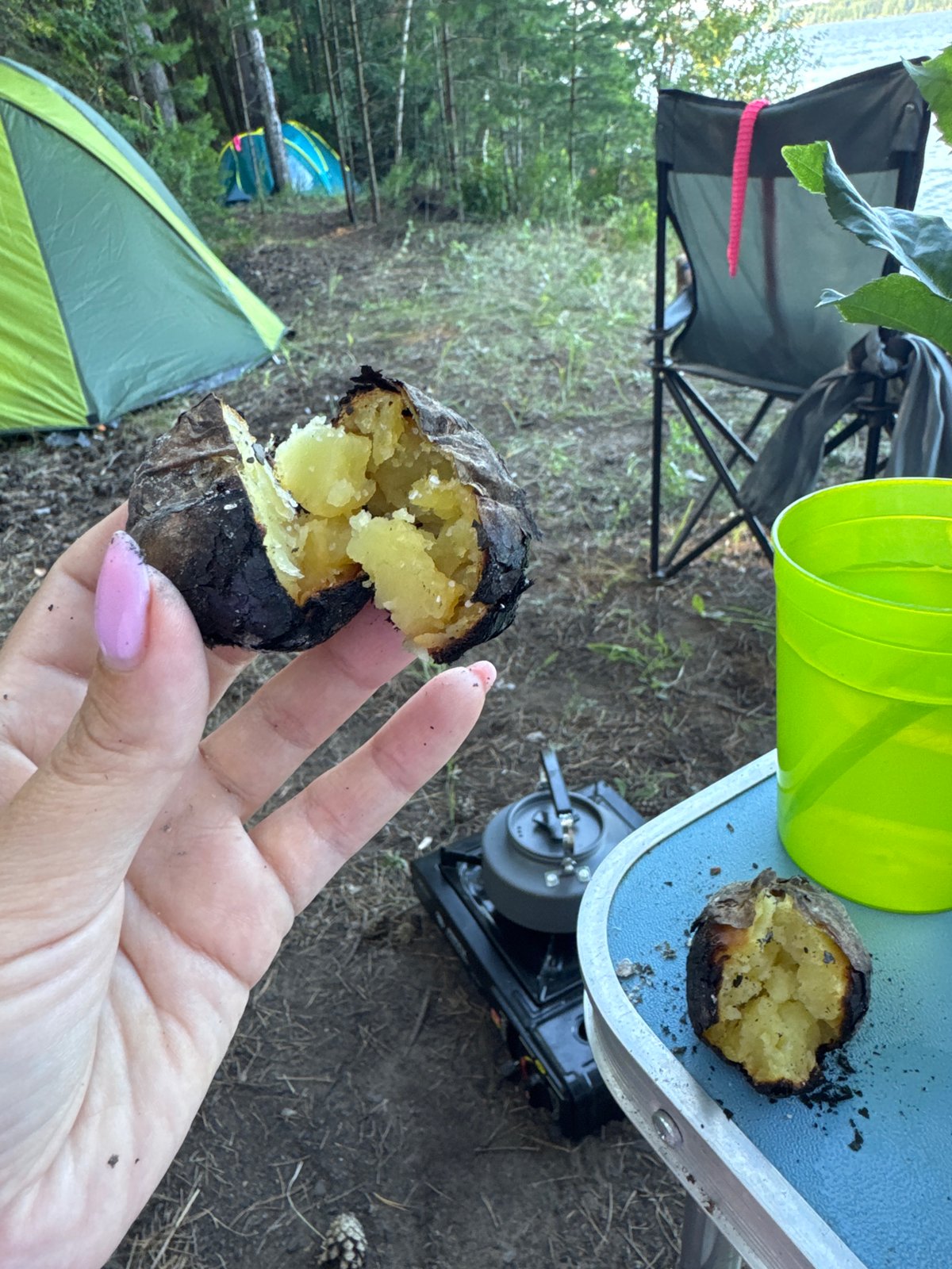Lakeside campfire cooking and camping near Chaikovsky, Russia