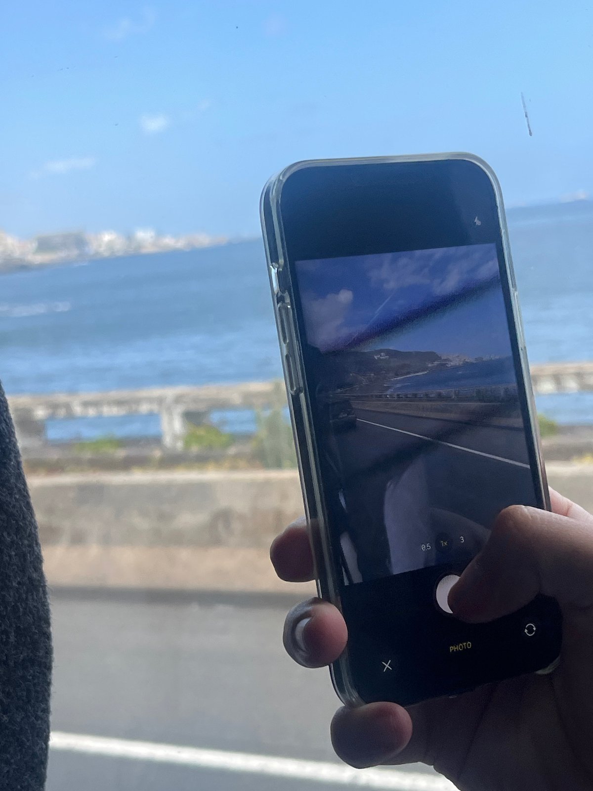 Person captures photo with smartphone in Telde, Spain
