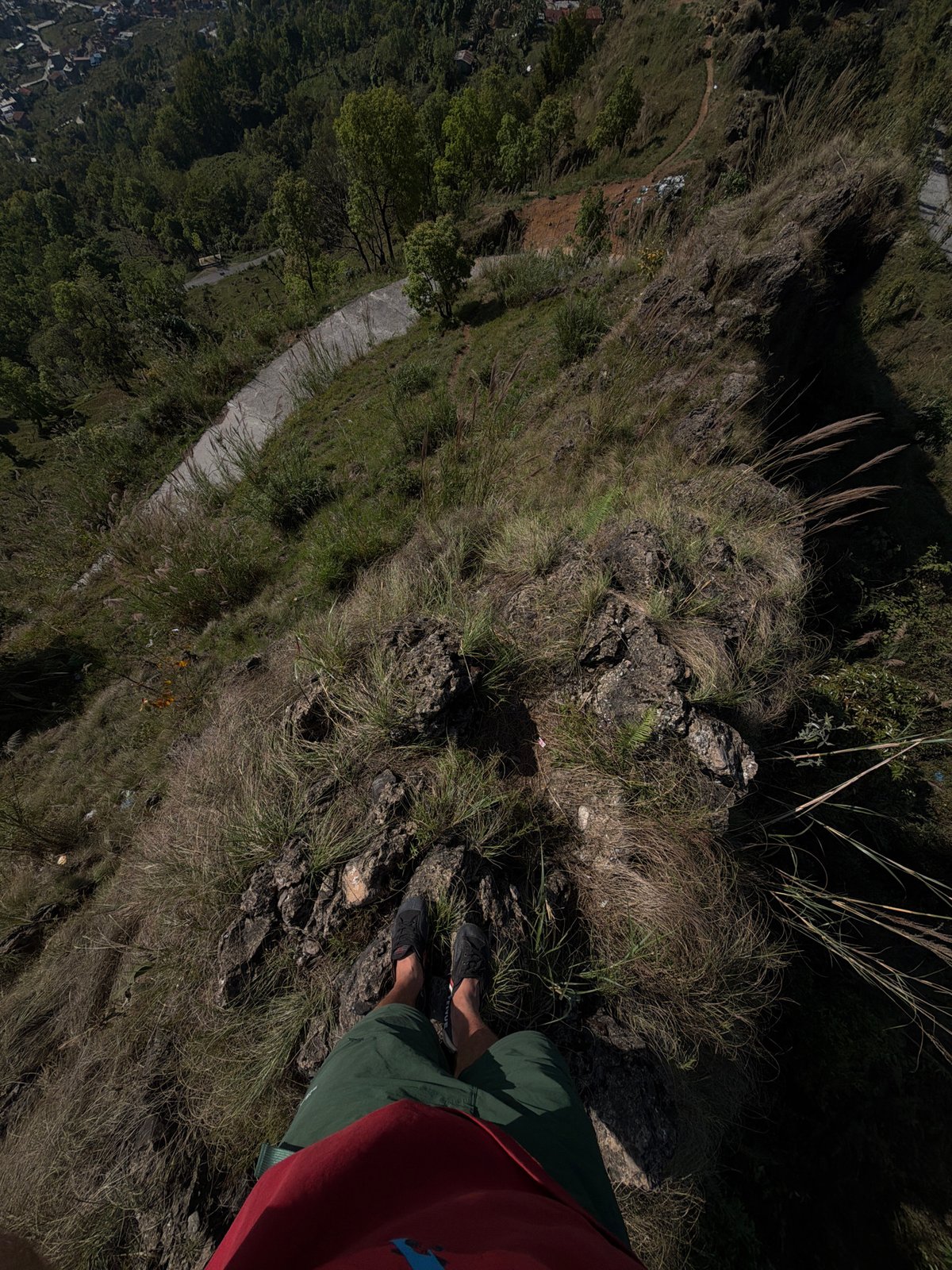 Person stands near cliff edge in Pokhara, Nepal