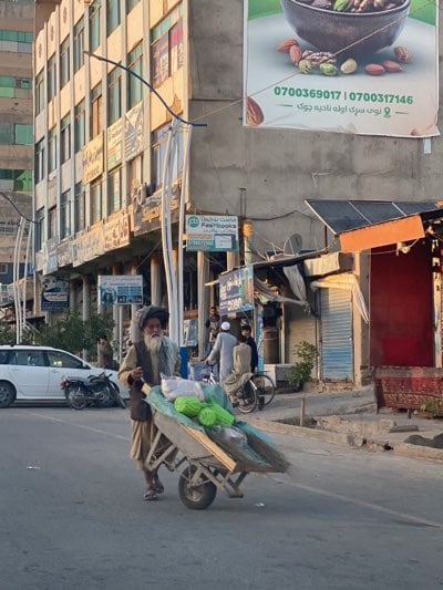 Kandahar street market bustles during afternoon golden hour