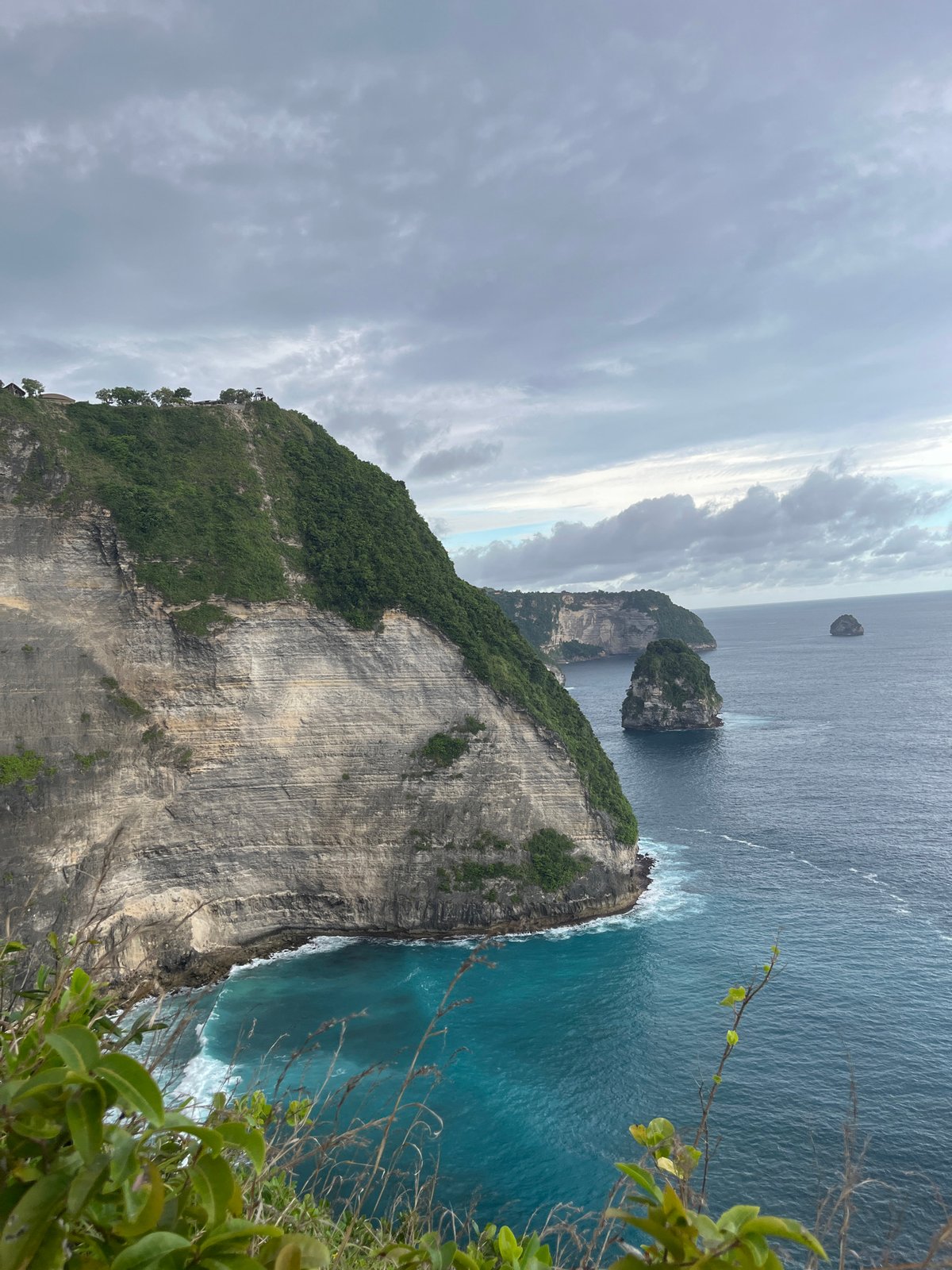 Dramatic coastal landscape photographed from Nusa Penida vantage point