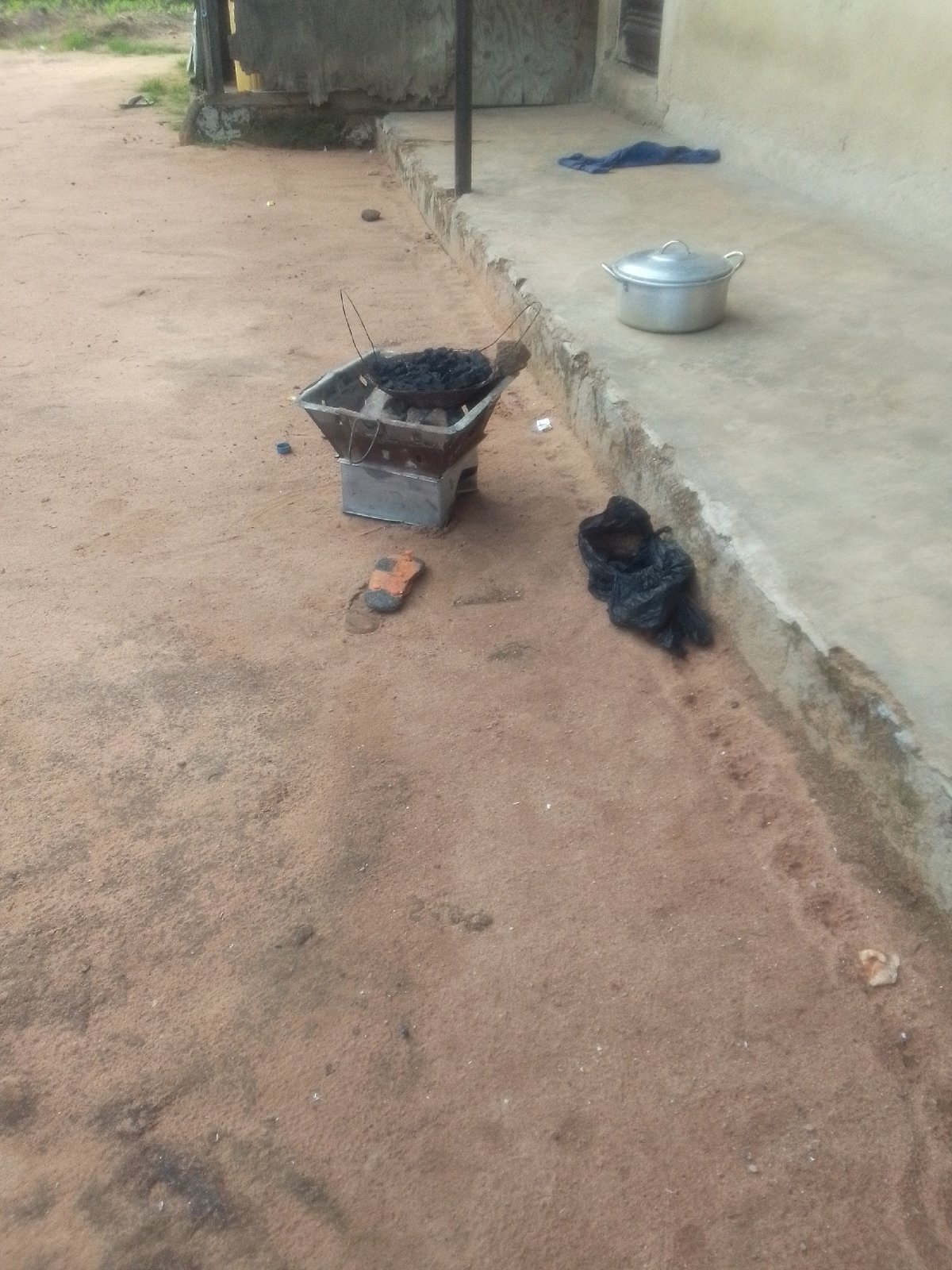 Everyday scenes from a Jalingo neighborhood: fences, fields, and street life