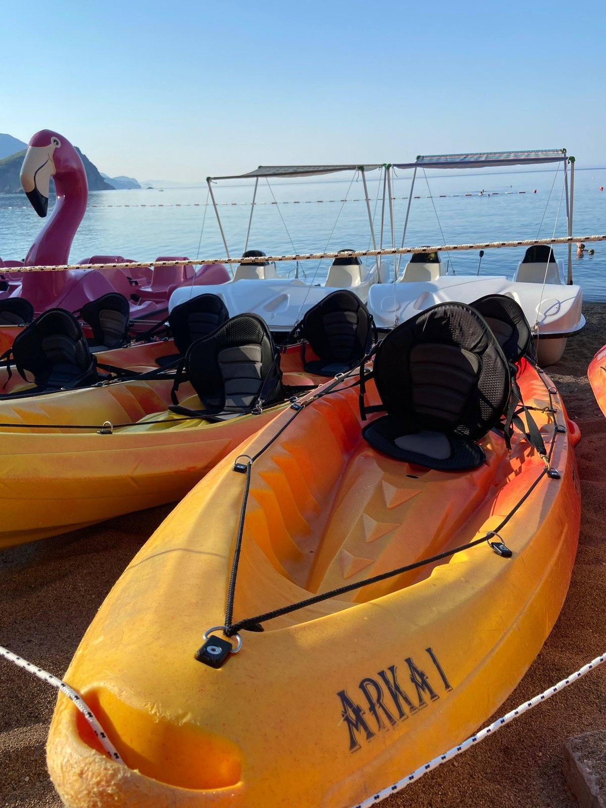 Quiet morning along Budva's beach and rocky shoreline