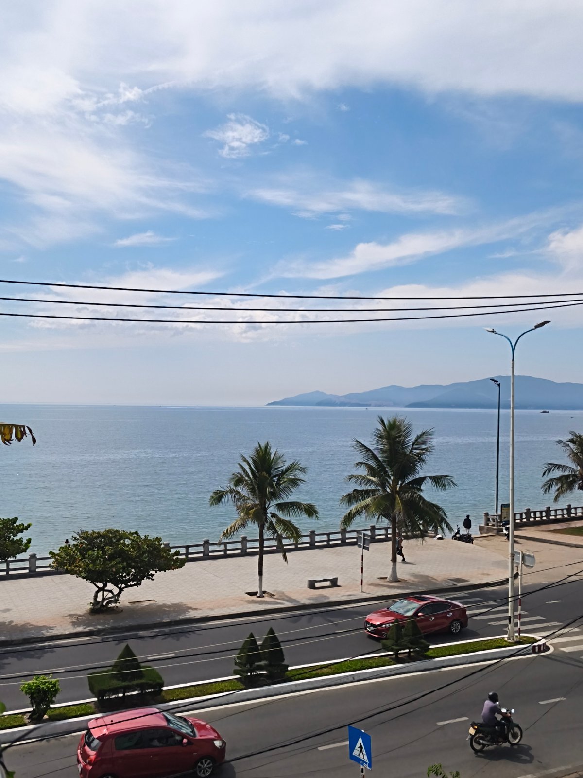 Nha Trang coastal scenes: ocean views, beachfront streets, and fruit drinks