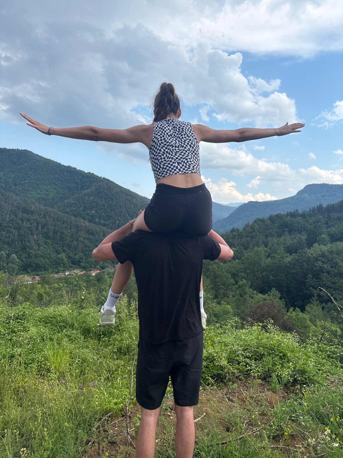 Hikers explore mountainous terrain with valley views June 6