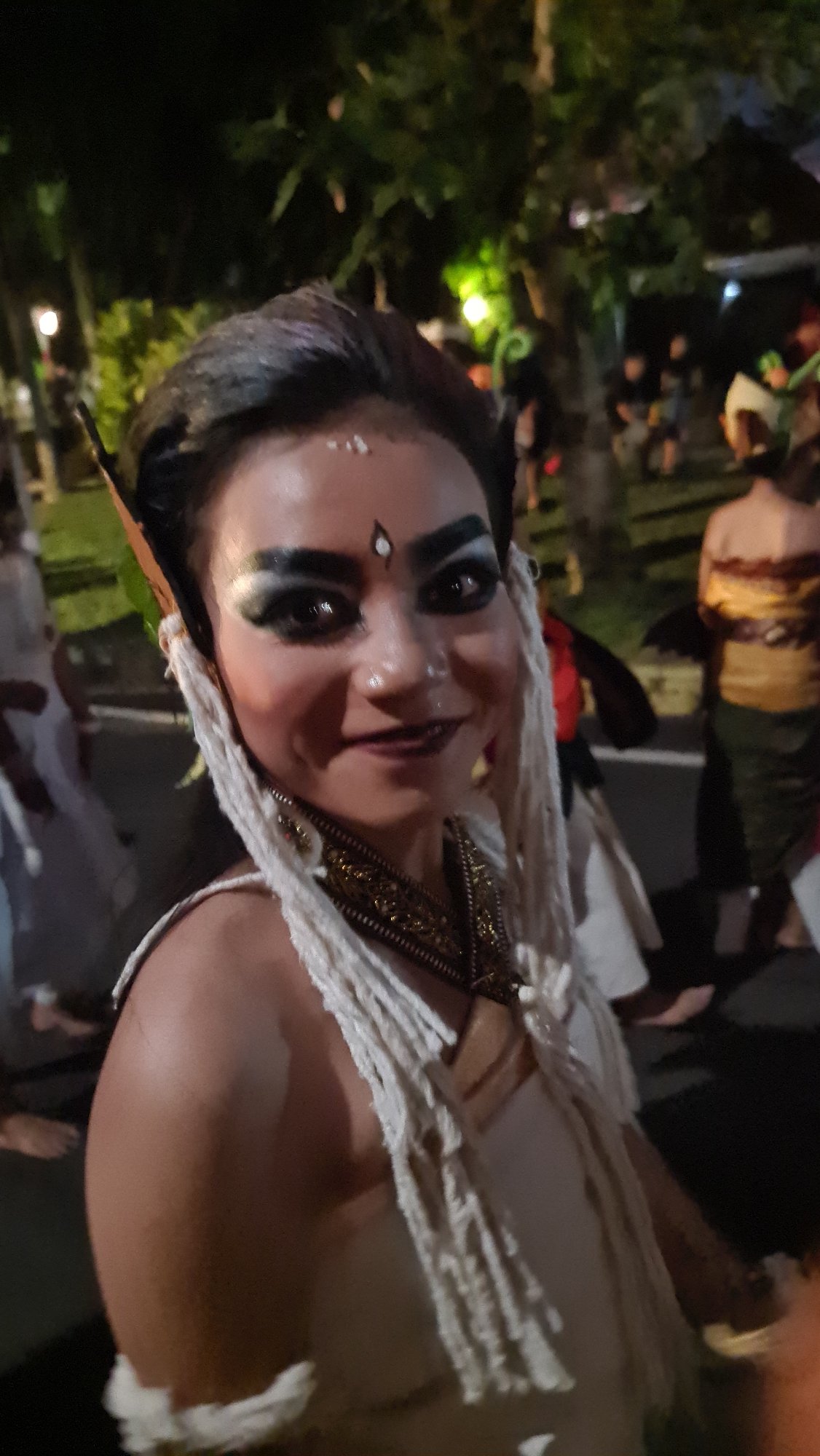 Elaborate Balinese performance costume and makeup, Denpasar