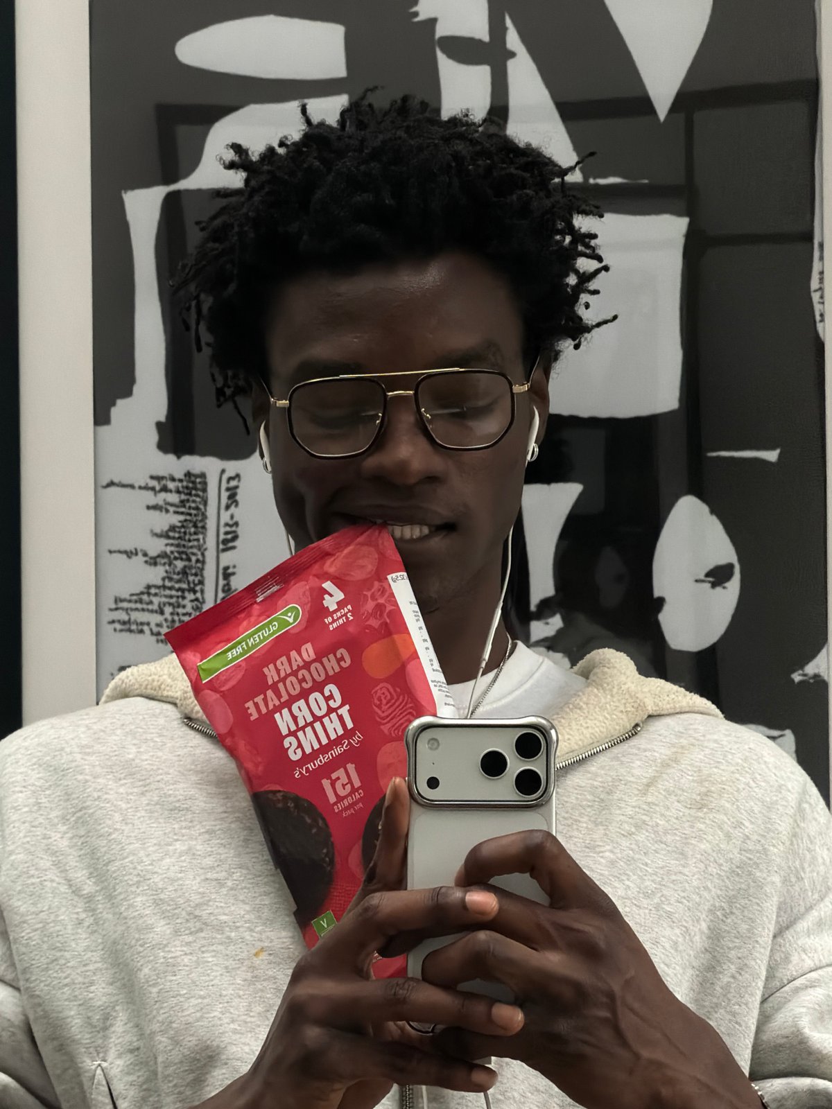 Two young people take selfies in London indoor locations
