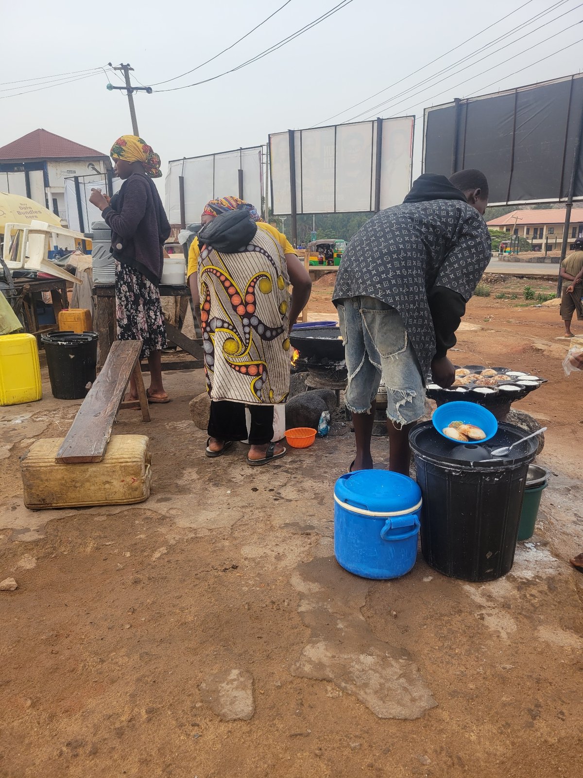 Morning street scene: outdoor cooking and pedestrian activity documented