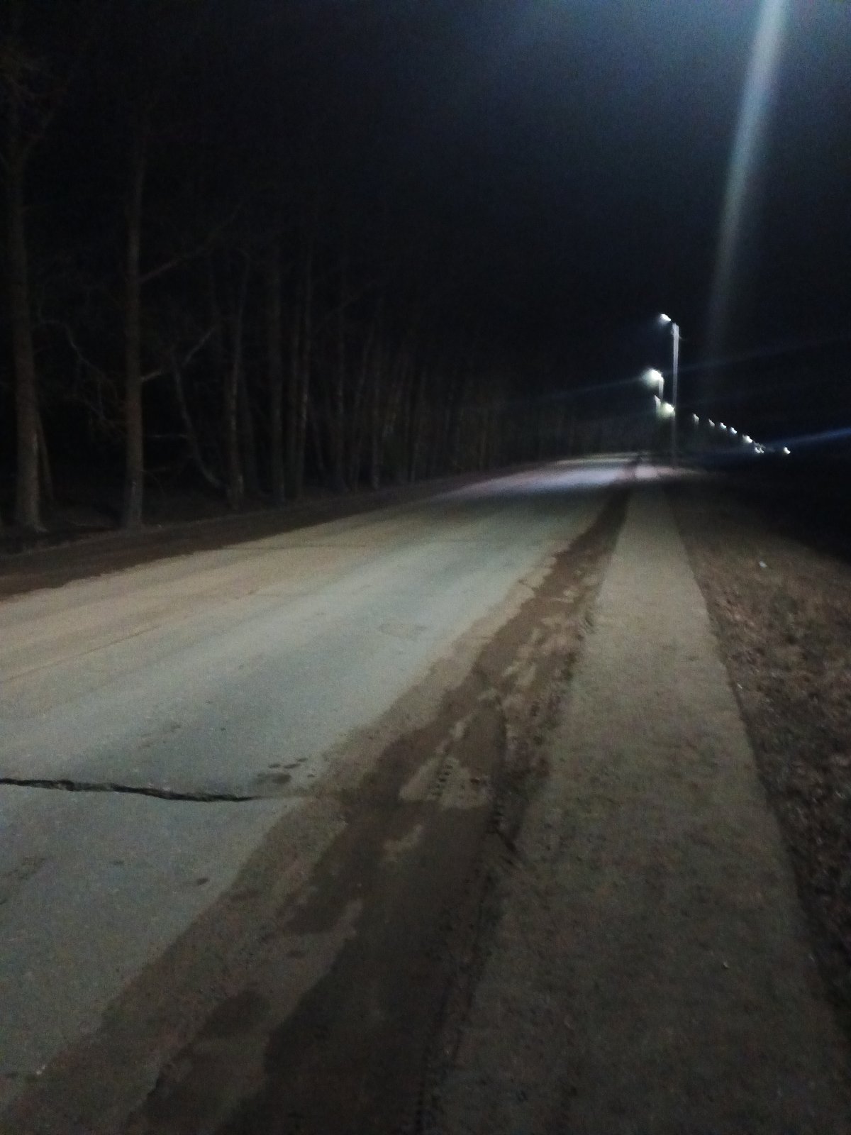 Nighttime documentation of Rusalevka streets and Soviet tractor monument