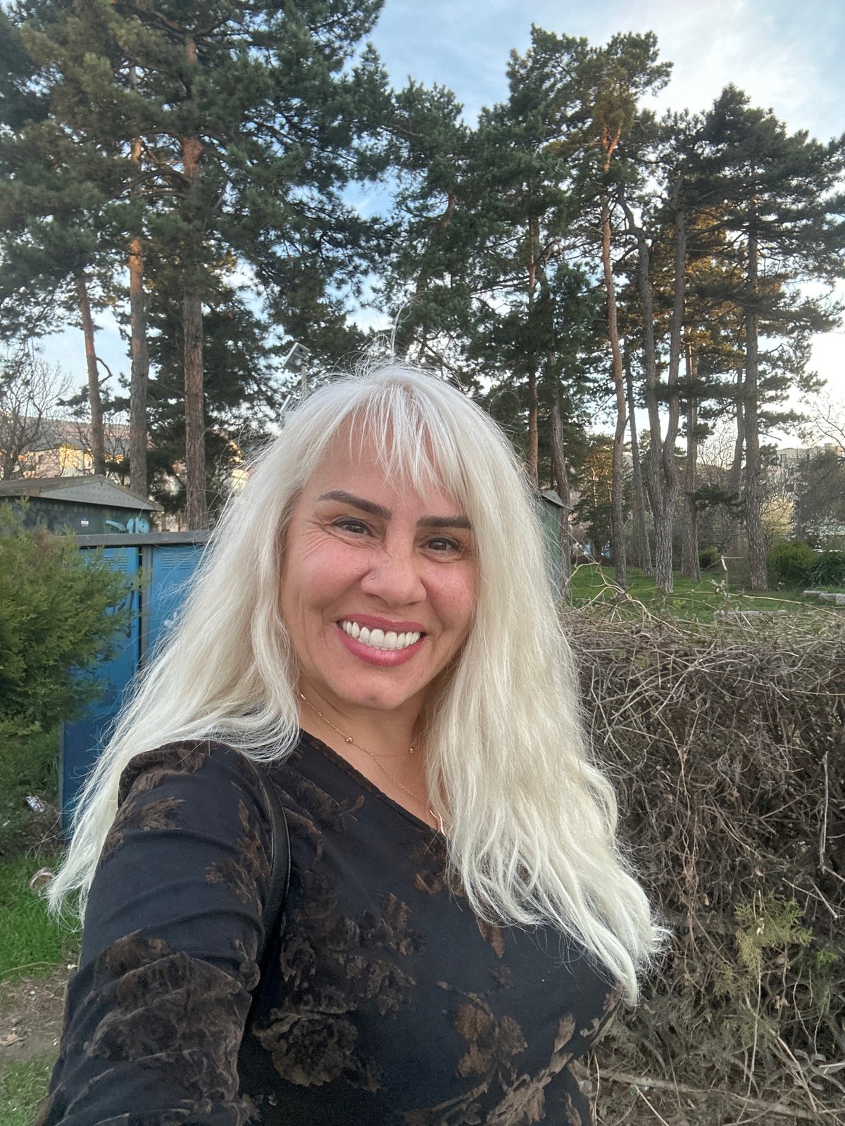 Woman photographed smiling in Sofia landscape setting