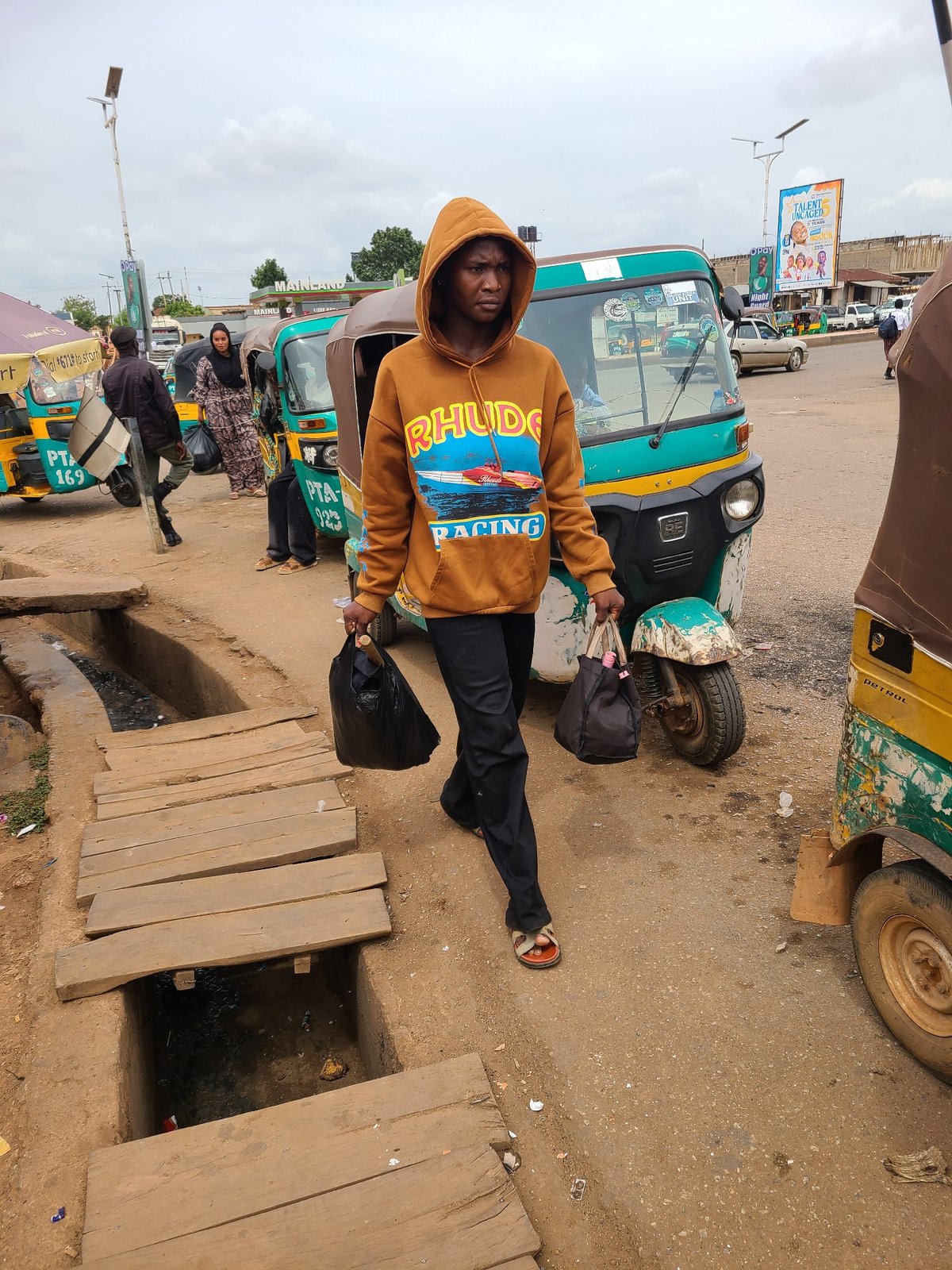 Urban street life documented across busy market district
