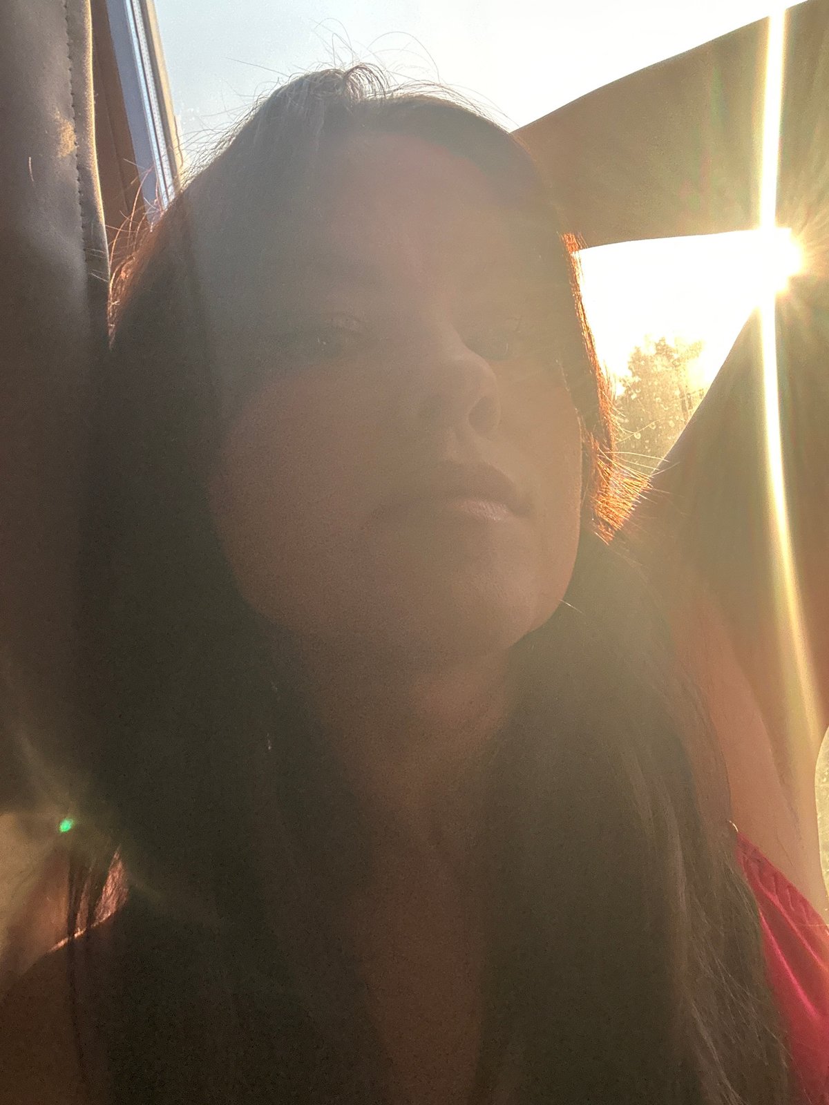 Person rests by sunny window in Chaikovsky, Russia