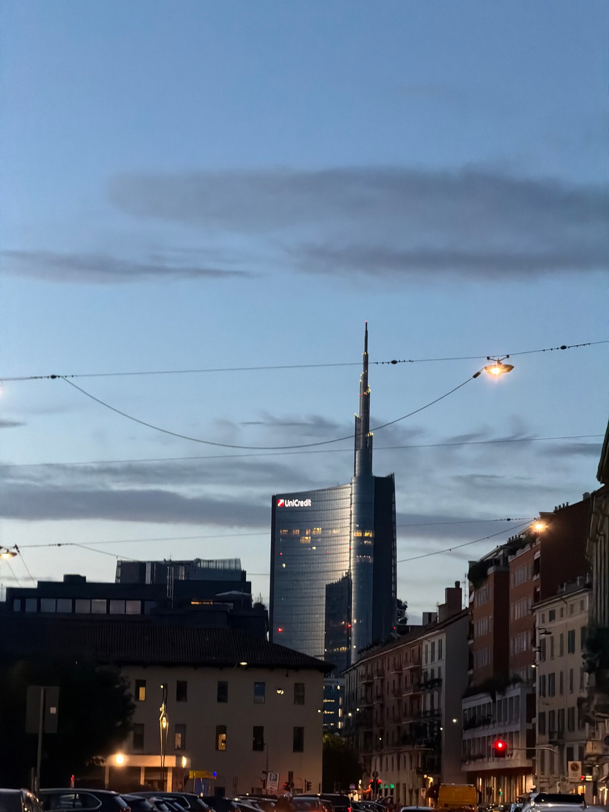 UniCredit Tower glows at dusk in Milan's Porta Nuova district