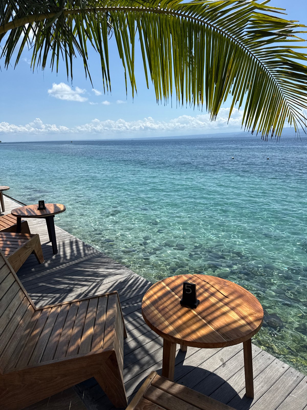 Morning relaxation on wooden deck at Nusa Penida waterfront