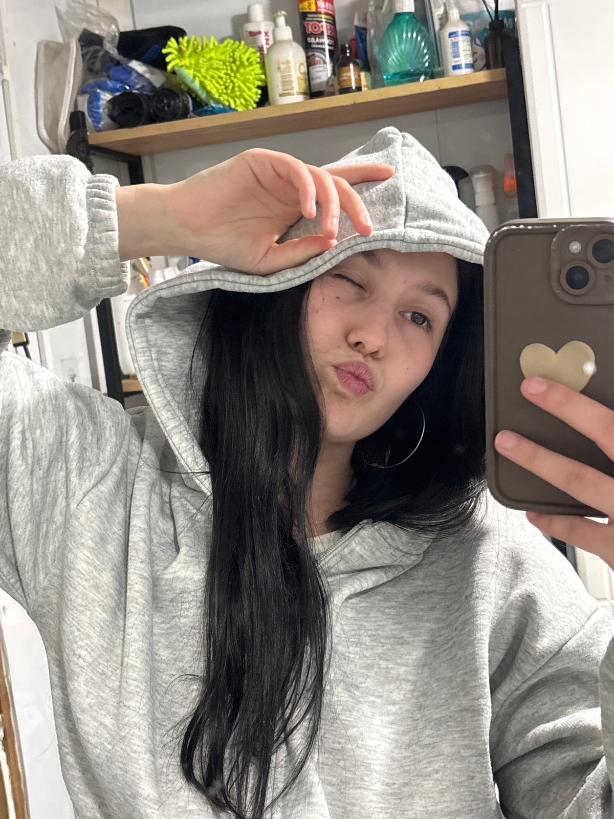 Woman documents casual afternoon with selfies and cat photos