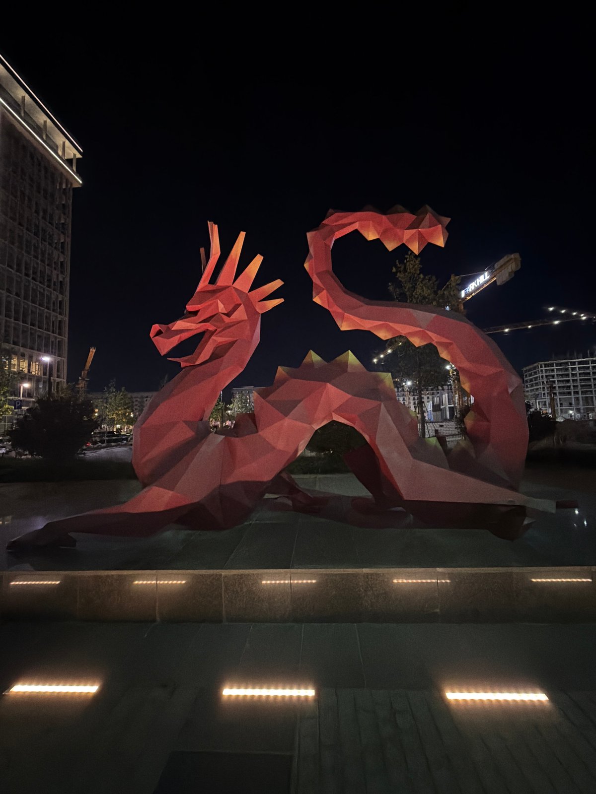 Lit public sculptures at night in Khatay Raion, Azerbaijan