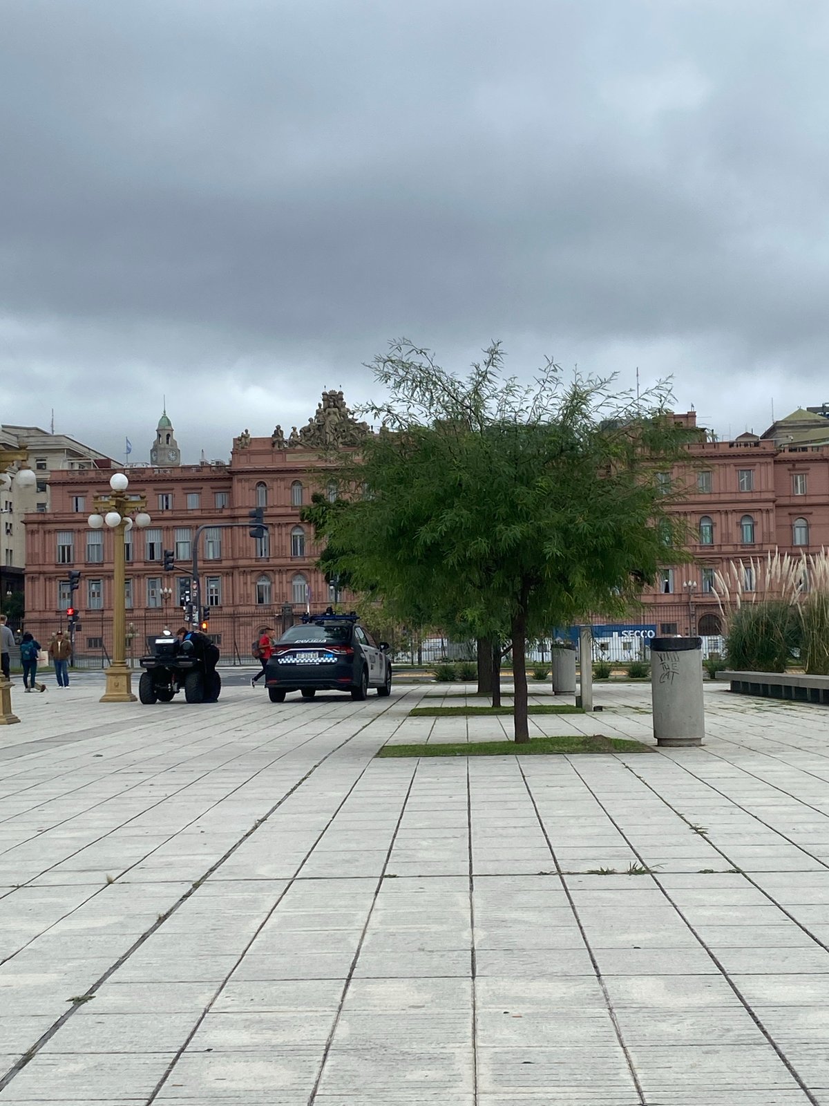 Motorcyclist waits at red light near Casa Rosada, Buenos Aires