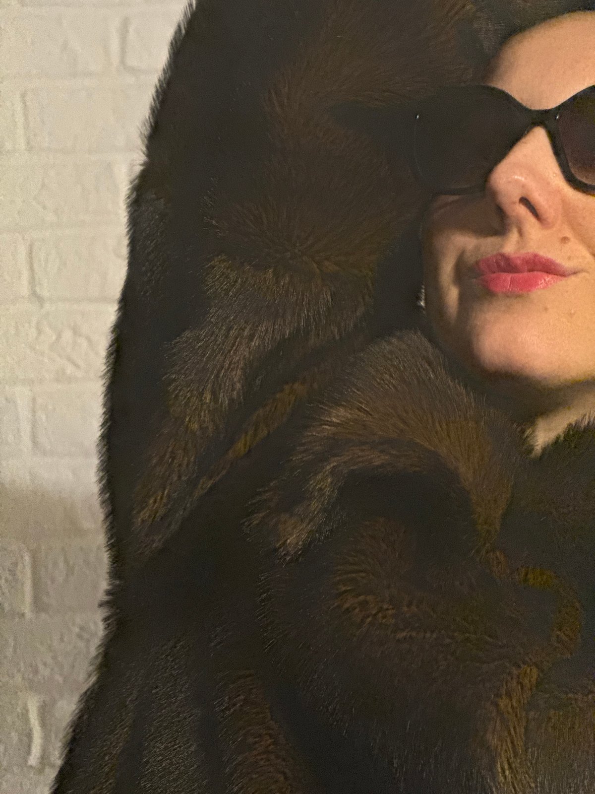 Woman in fur coat photographed with flower in Carnikava