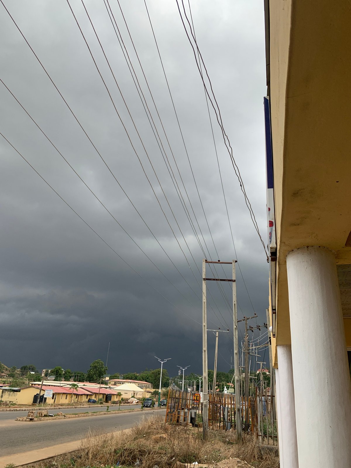 Storm clouds gather over Jos streets as traffic continues