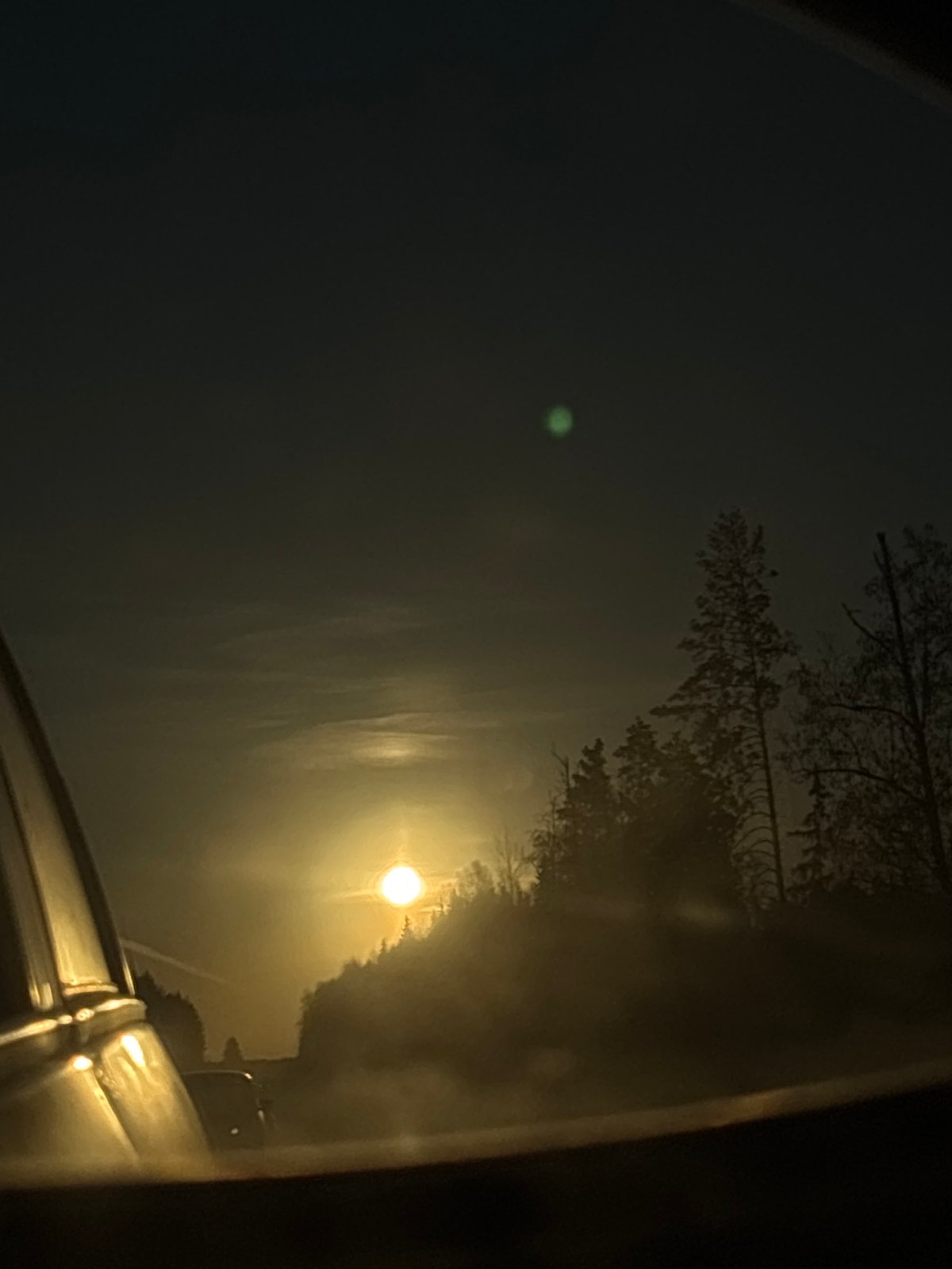 Nighttime street scene captured from vehicle in Garevaya, Russia