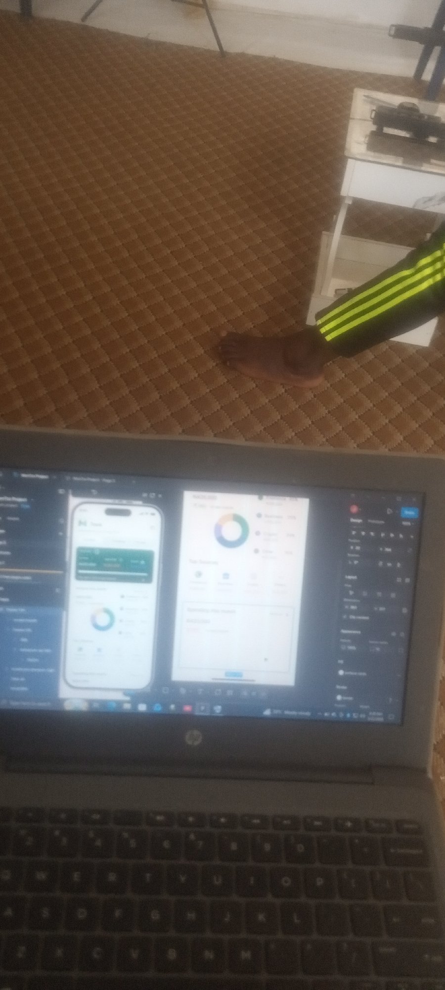 Person works on laptop app design in indoor setting