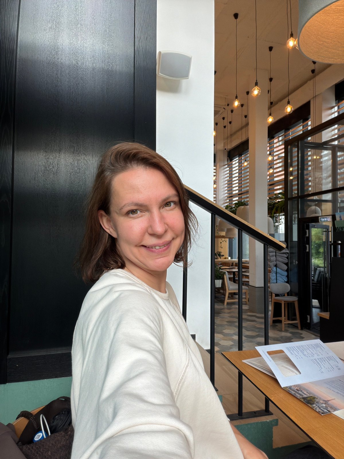 Woman dines at modern cafe in Izhevsk city center