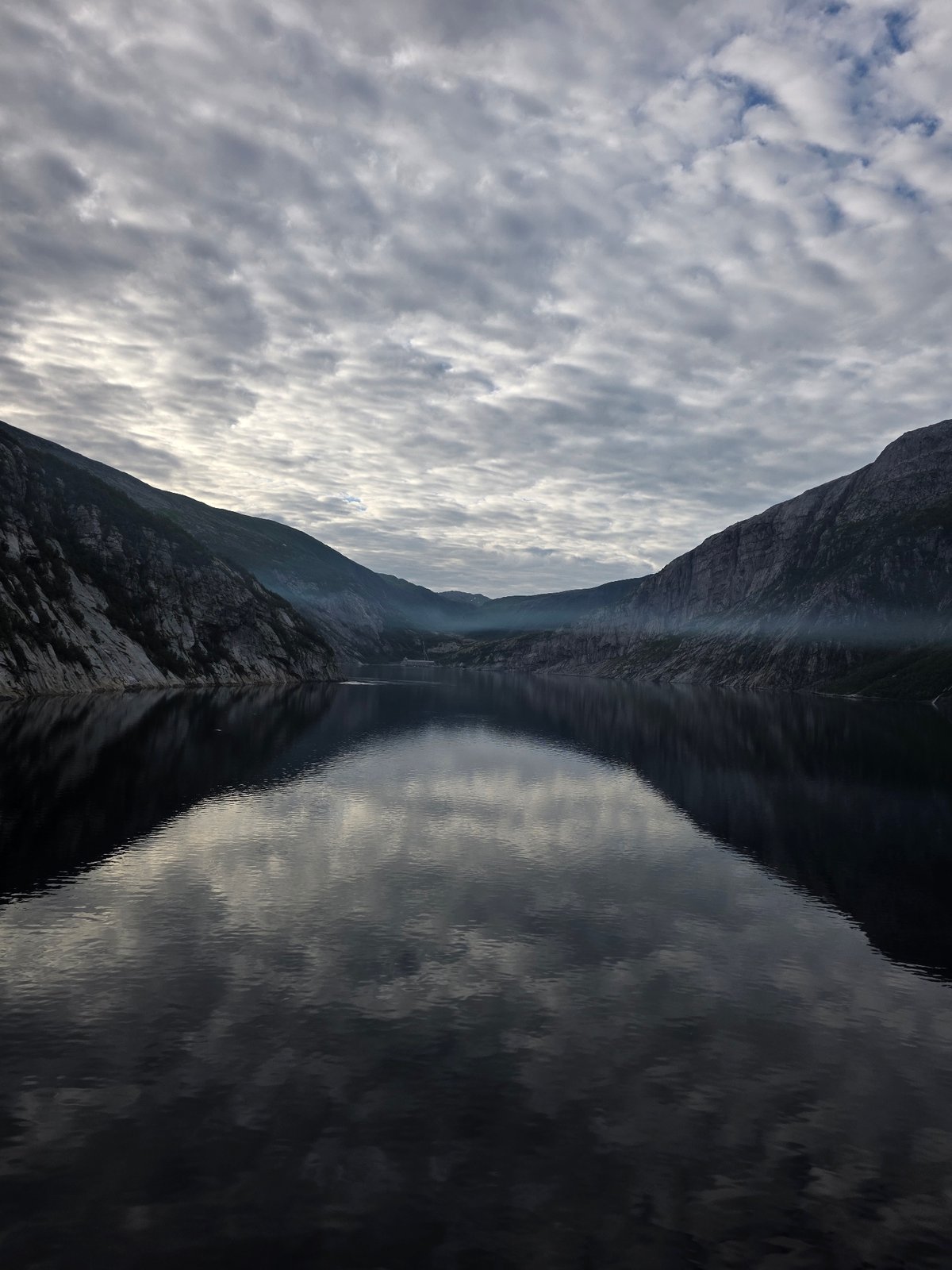 Glomfjord's rugged fjord and waterside power station, Norway