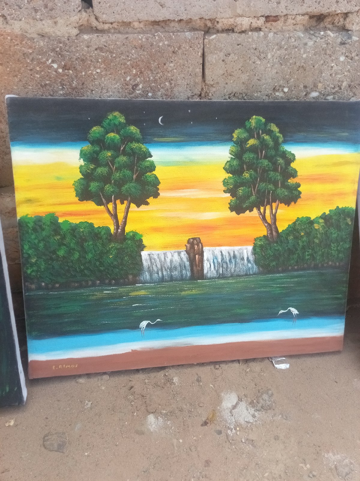 Outdoor art market displays paintings in El Dátil, Venezuela