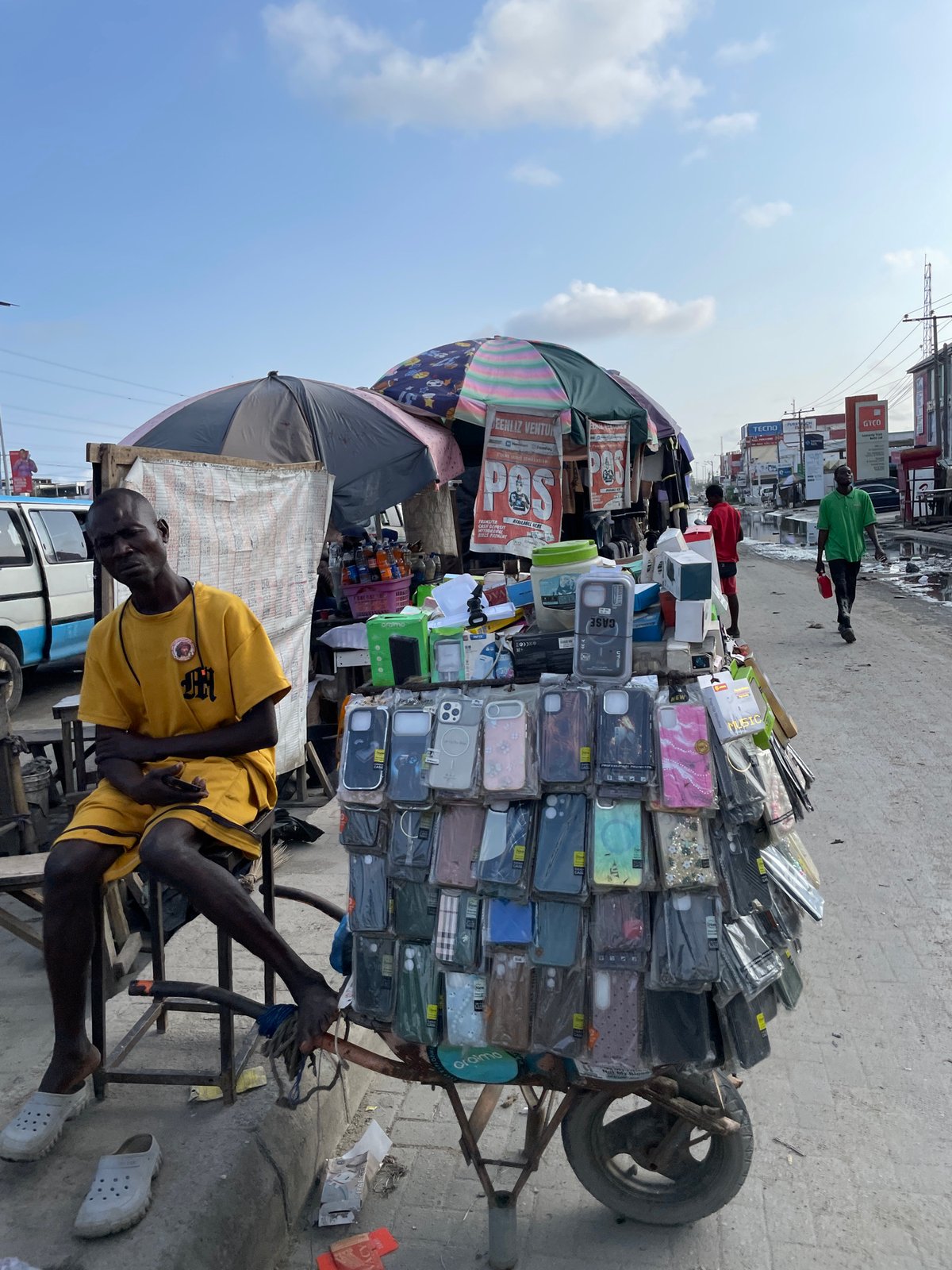 Lekki street commerce and everyday movement on a wet afternoon