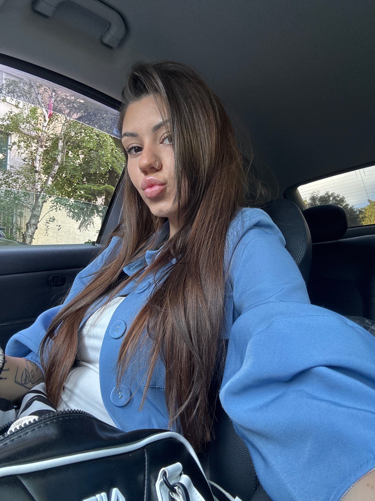 Woman photographed in car during morning hours in Sofia