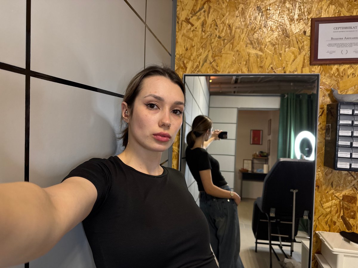 Tattoo session and mirror selfies captured at studio location