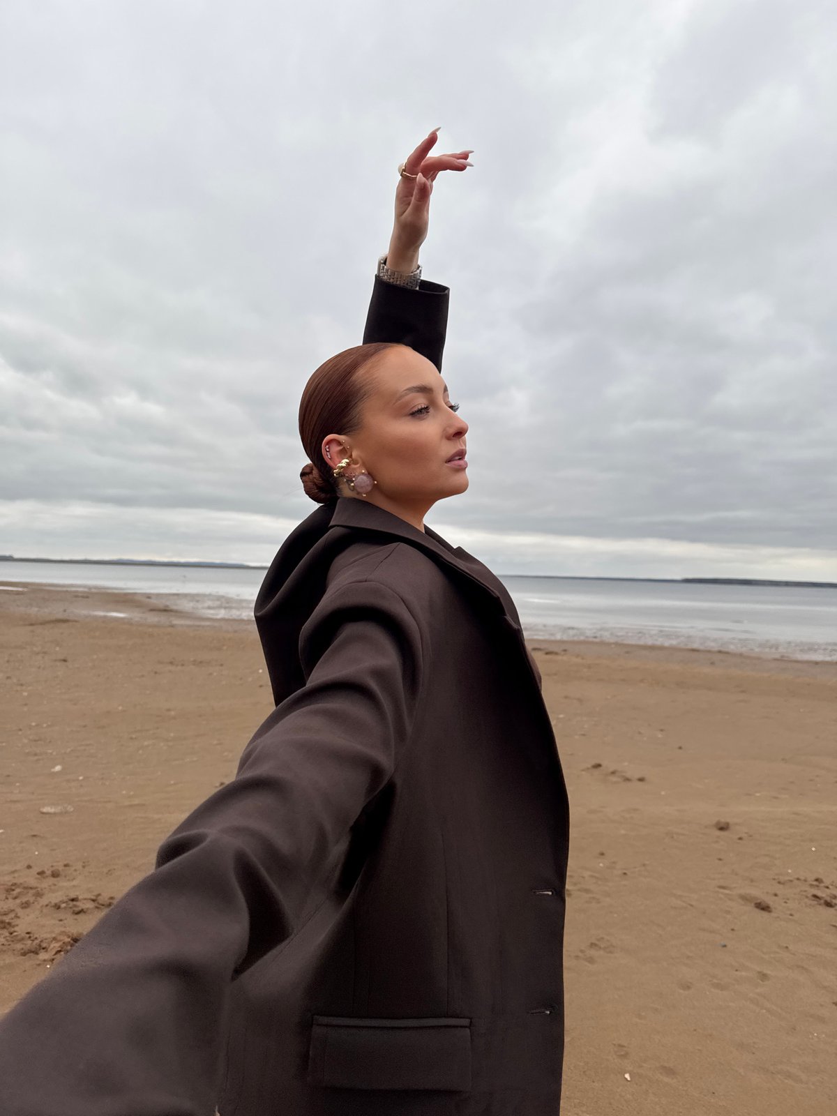 Woman photographed in contemplative beach portraits in Chaikovsky, Russia